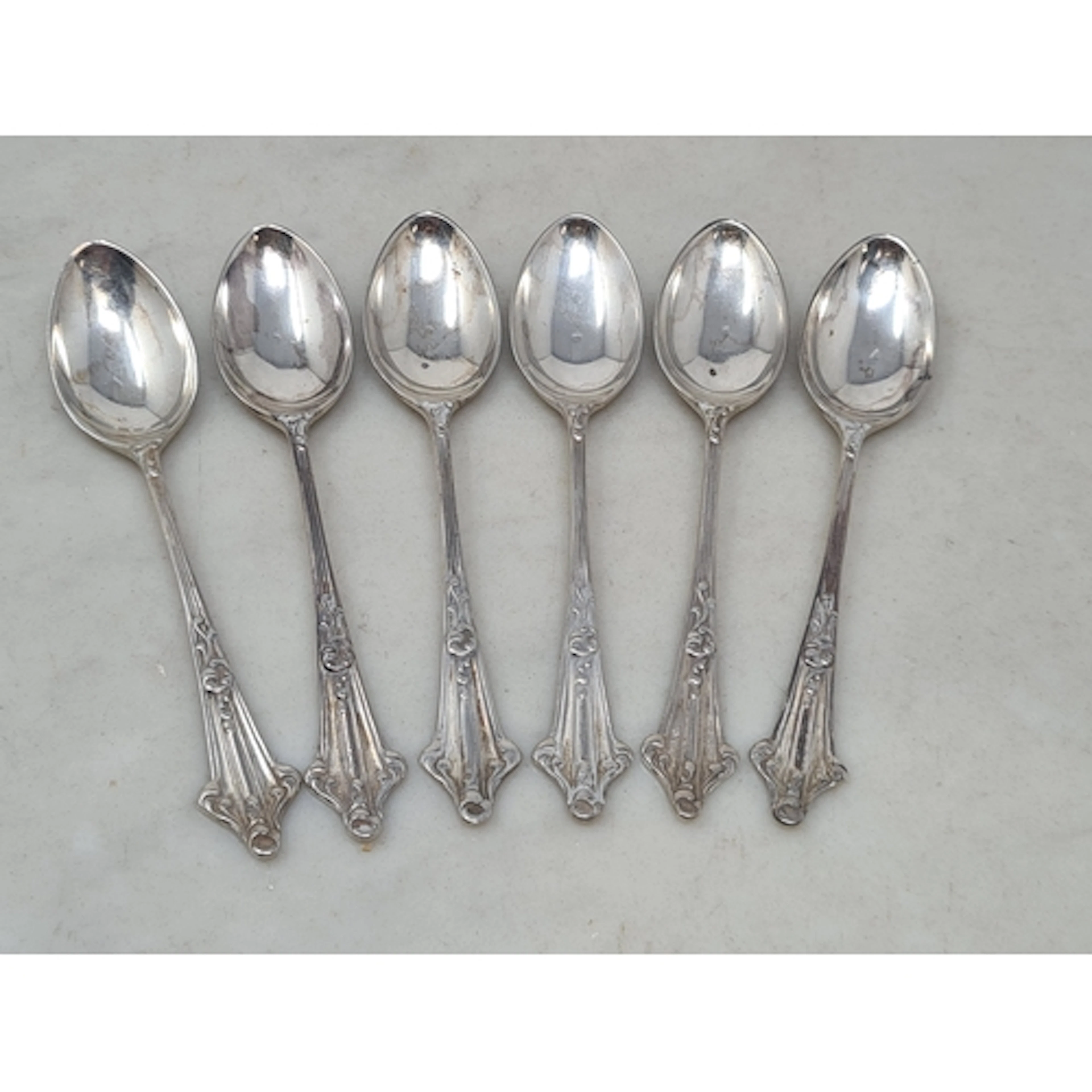 Six George VI silver Coffee Spoons with ornate handles, Shef...