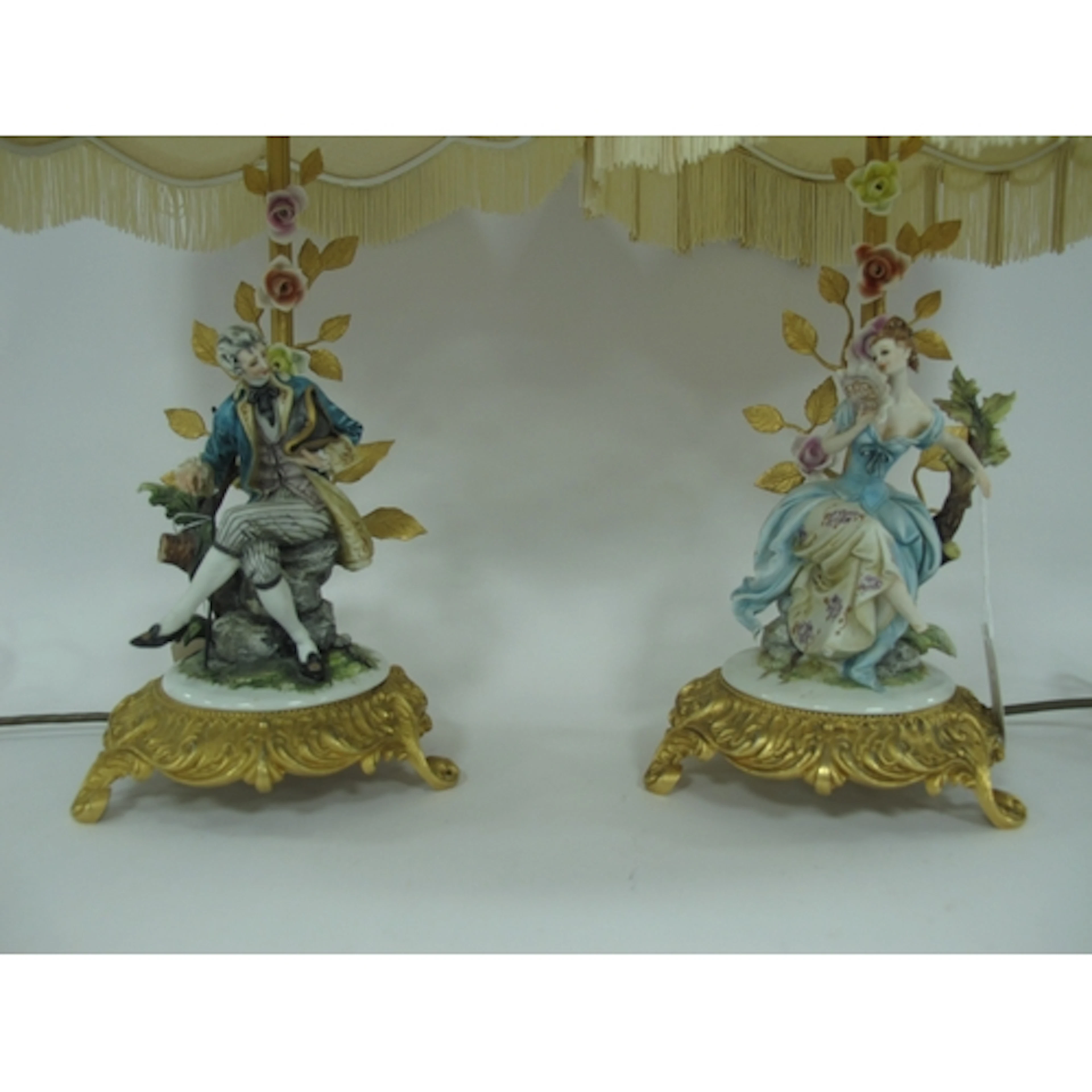 A pair of Italian Capodimonte porcelain figural table lamps ...
