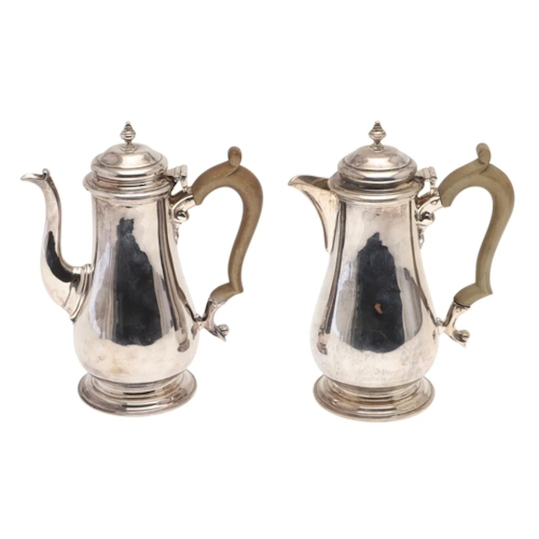 A 1930'S SILVER COFFEE POT AND HOT WATER POT. Of baluster fo...