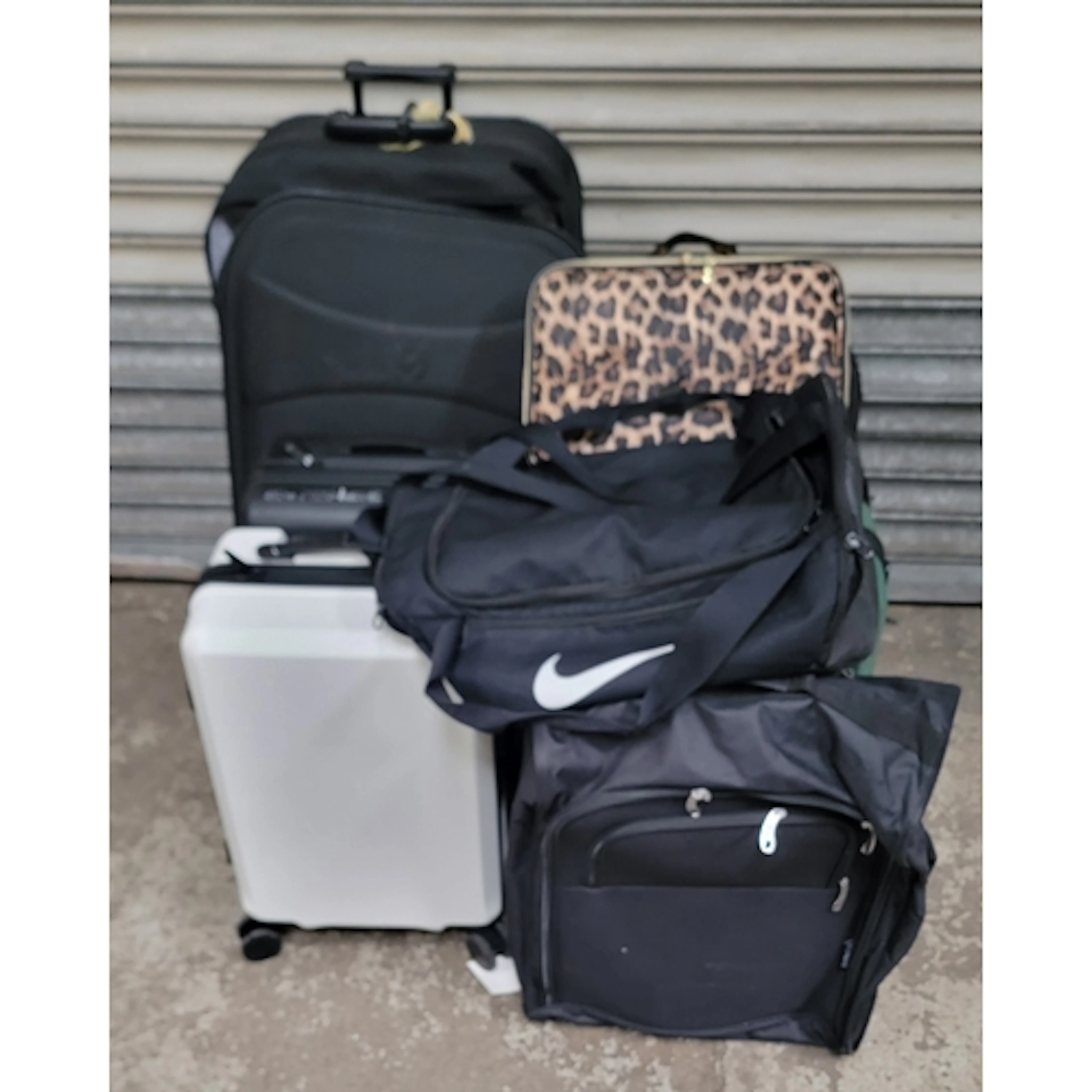 SELECTION OF SEVEN SUITCASES, ONE HOLDALL, AND ONE MAKEUP BA...