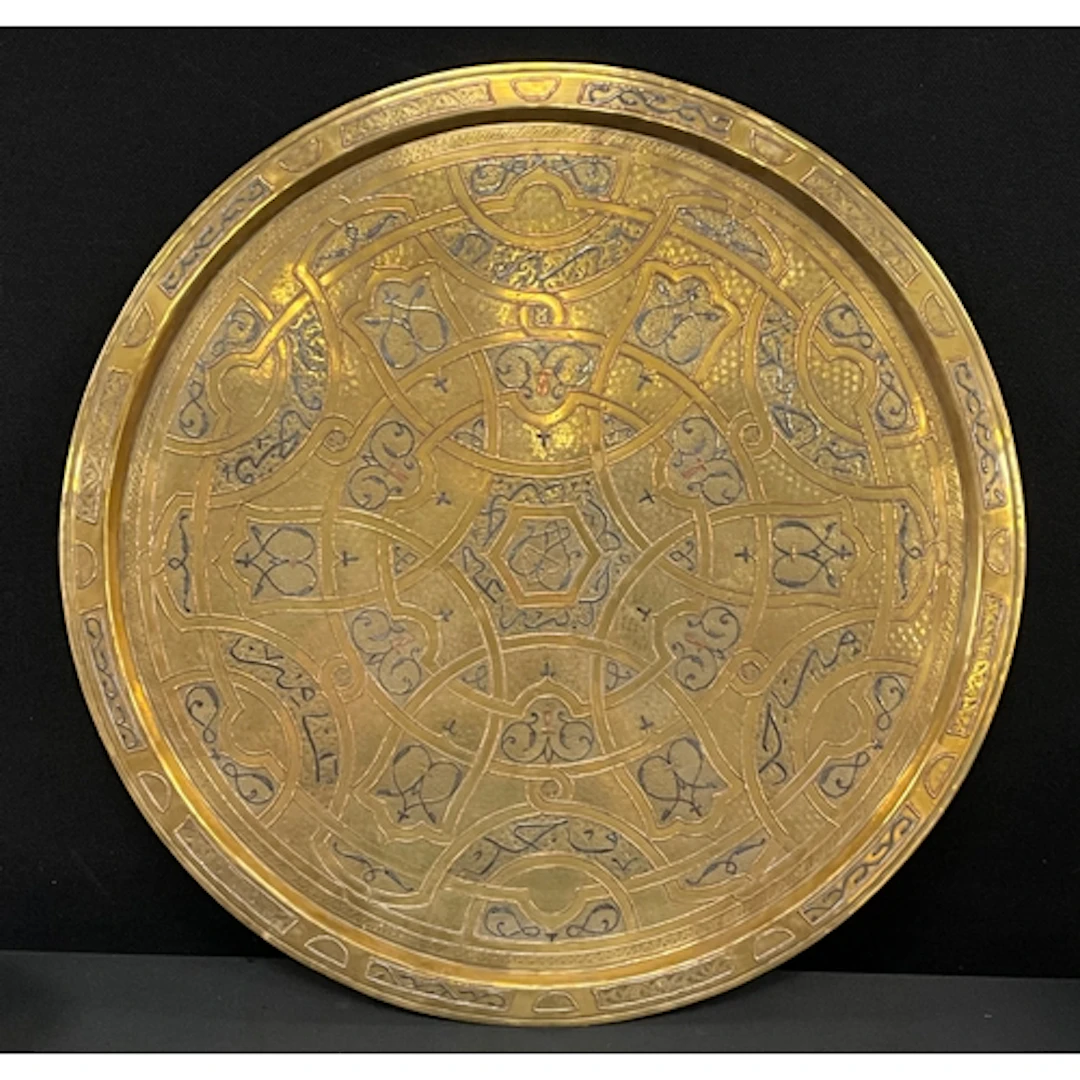 A 20th century Anglo-Indian style brass charger, inlaid with...