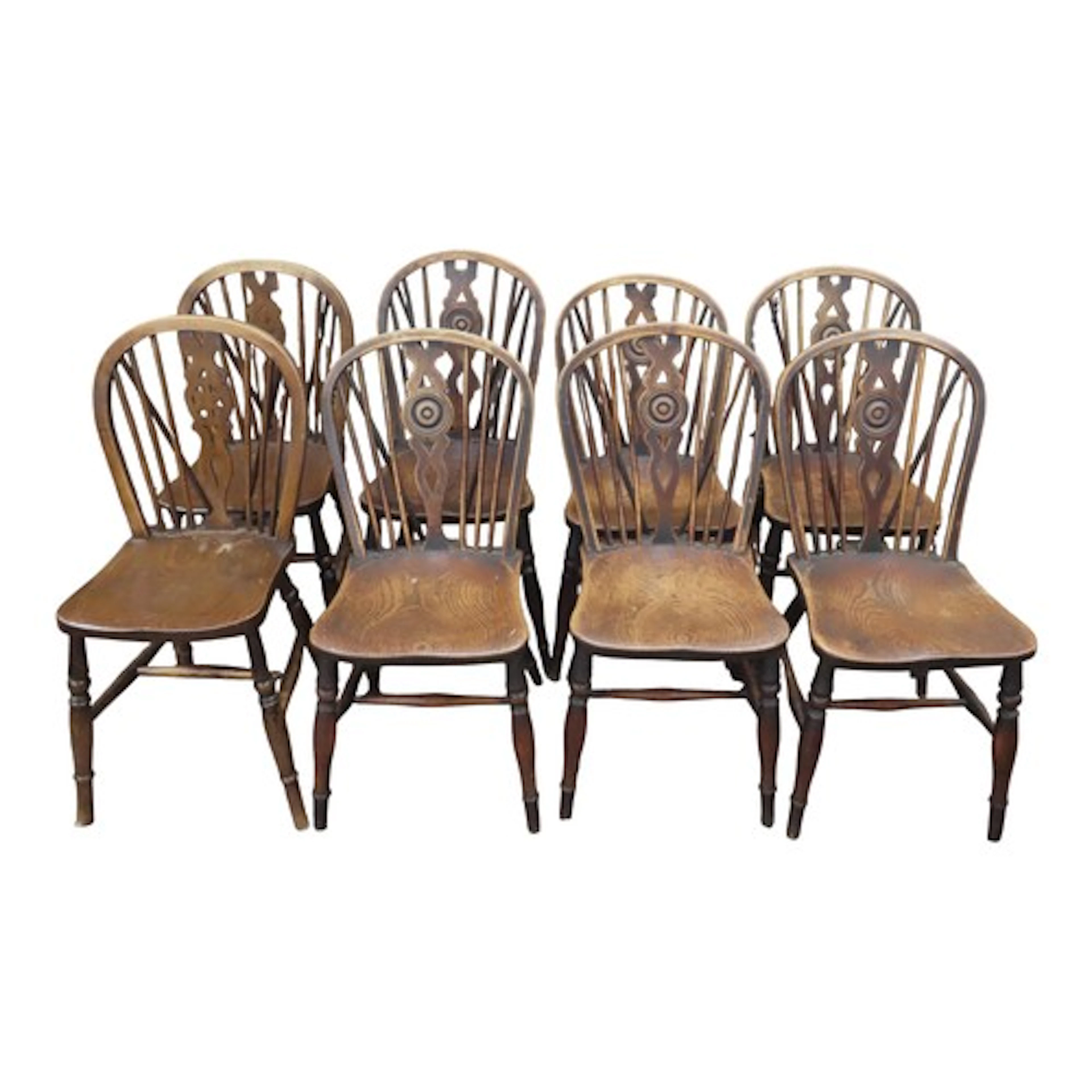 A set of six Georgian Windsor dining chairs in mixed woods, ...