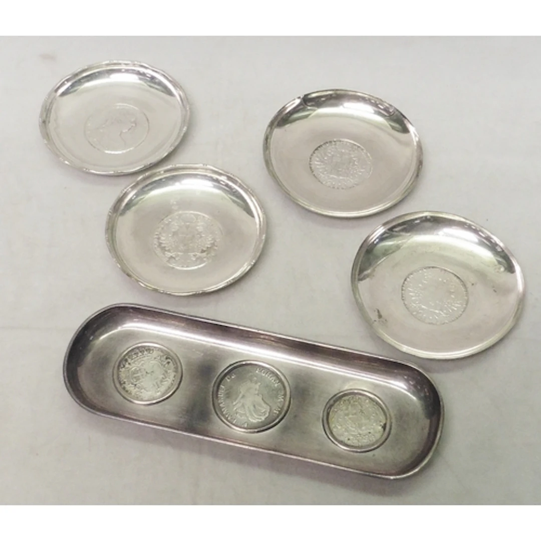 A pair of coin dishes, white metal marked Sterling and inset...