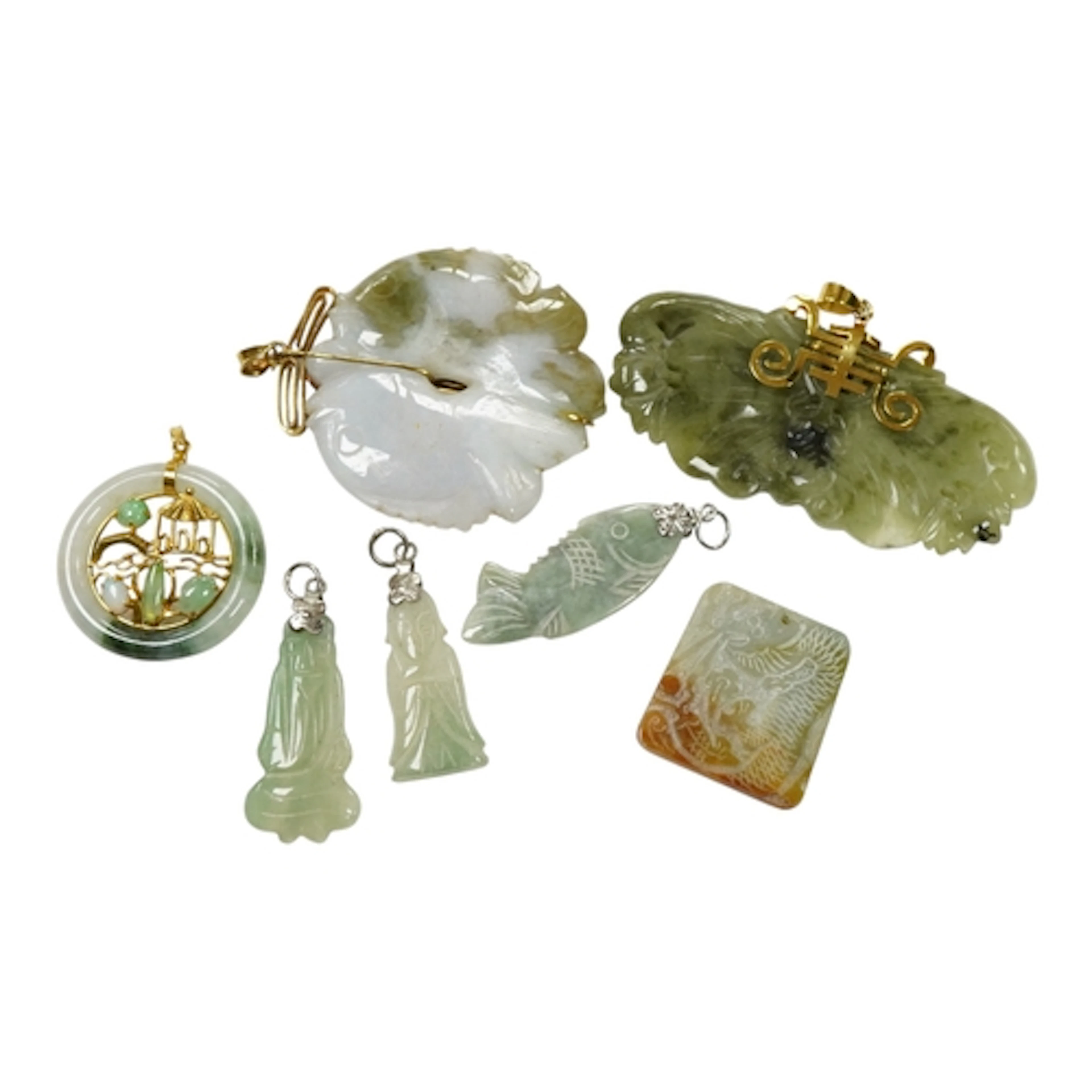 A collection of assorted nephrite/jadeite pendants, includin...