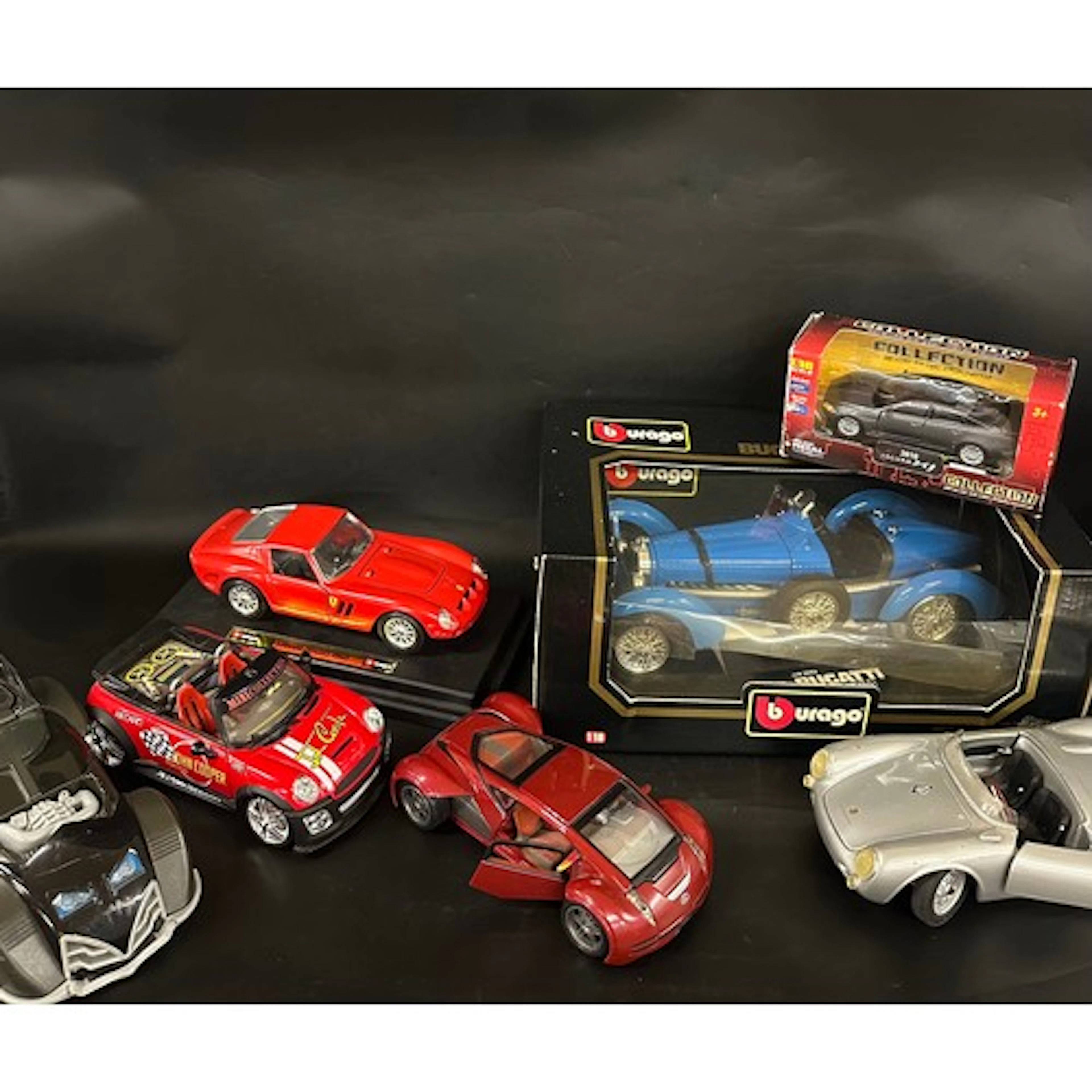 A collection of die-cast vehicles to include Burago Bugatti ...