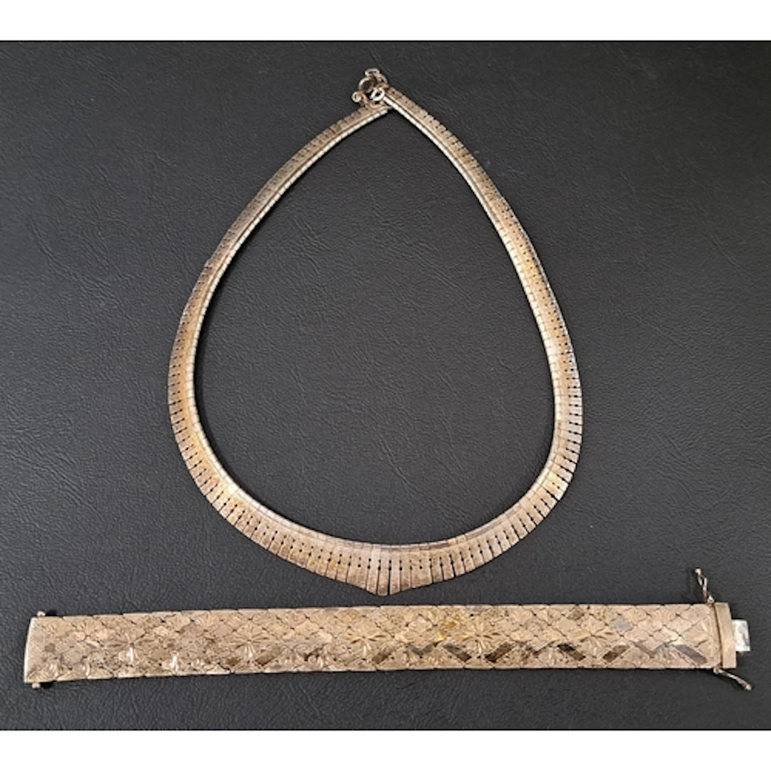 SILVER BRACELET AND NECKLACE the bracelet with engraved deco...