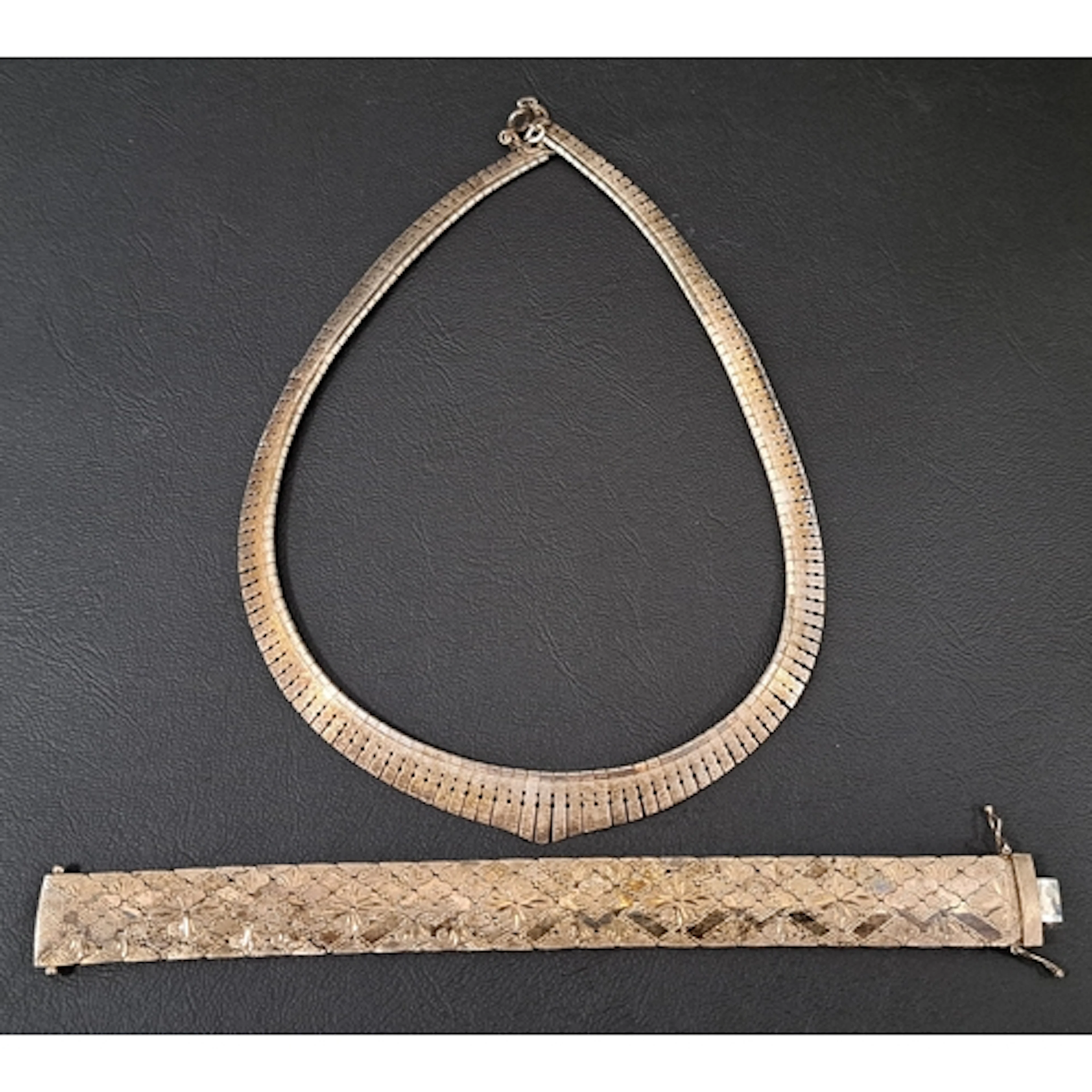 SILVER BRACELET AND NECKLACE the bracelet with engraved deco...
