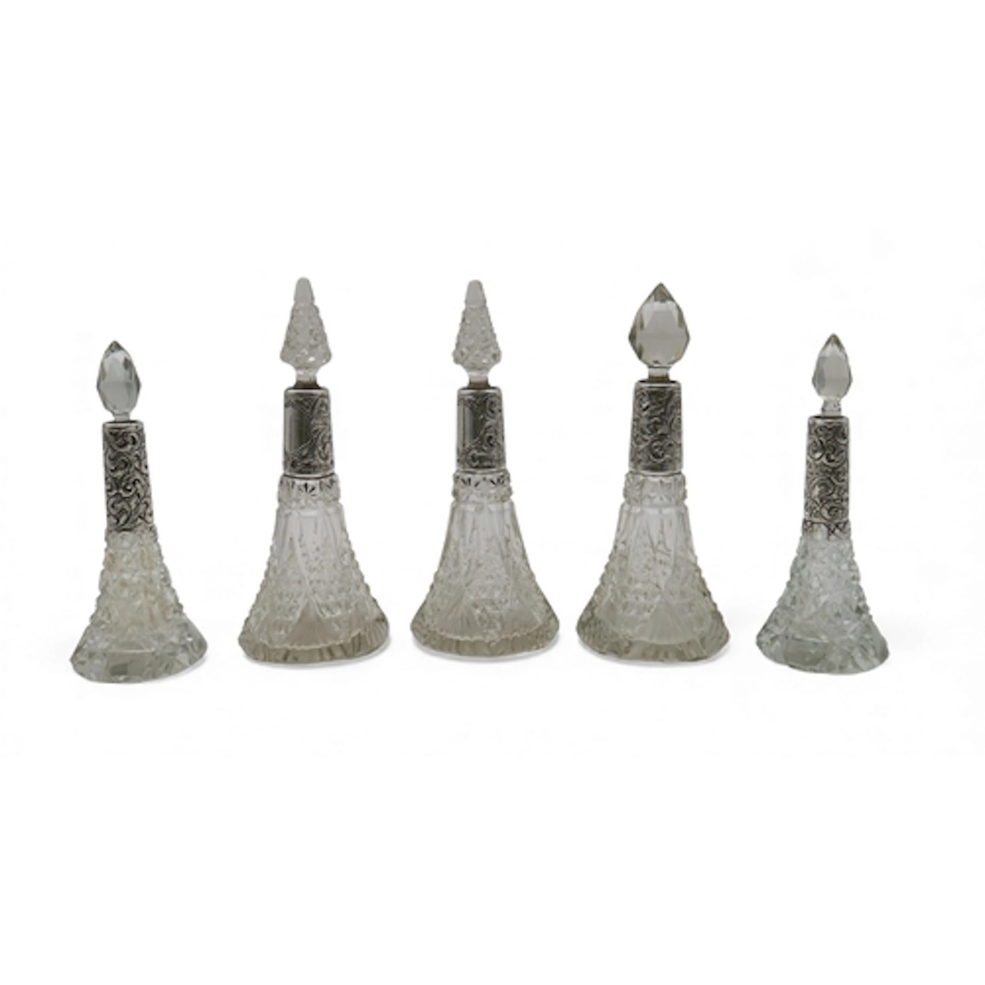 A collection of silver-collared cut glass scent bottles, inc...