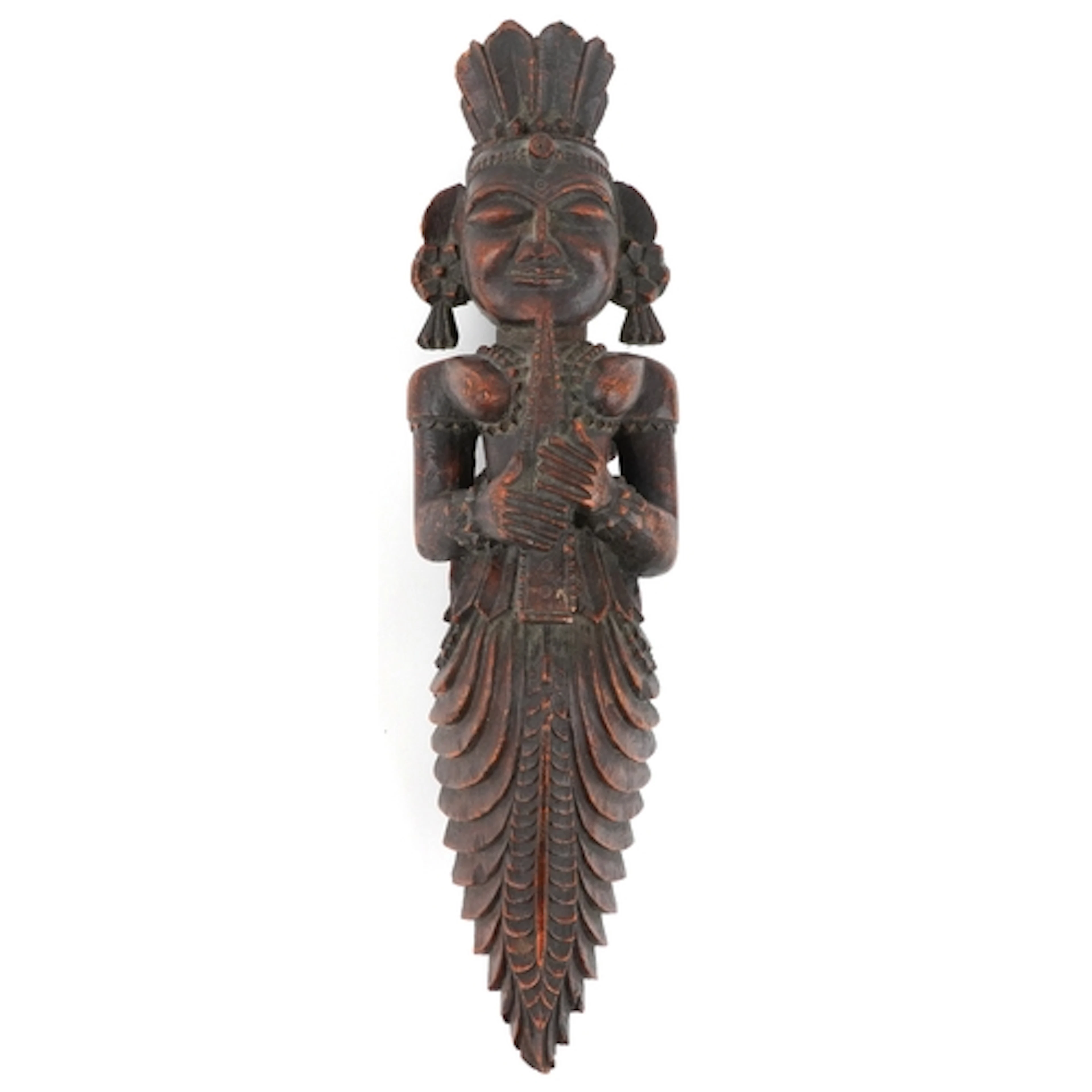 An Indonesian carved wood figure of a deity, modelled playin...