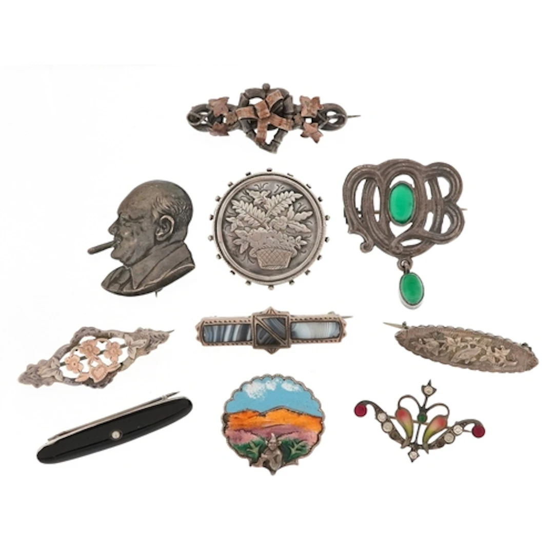 Antique and later silver brooches including a bust of Church...