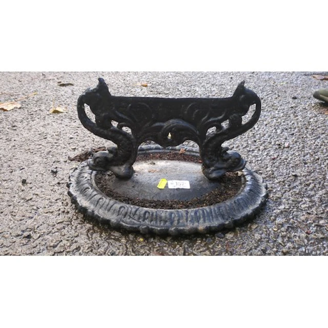 Victorian-style cast-iron boot scraper with a moulded border...