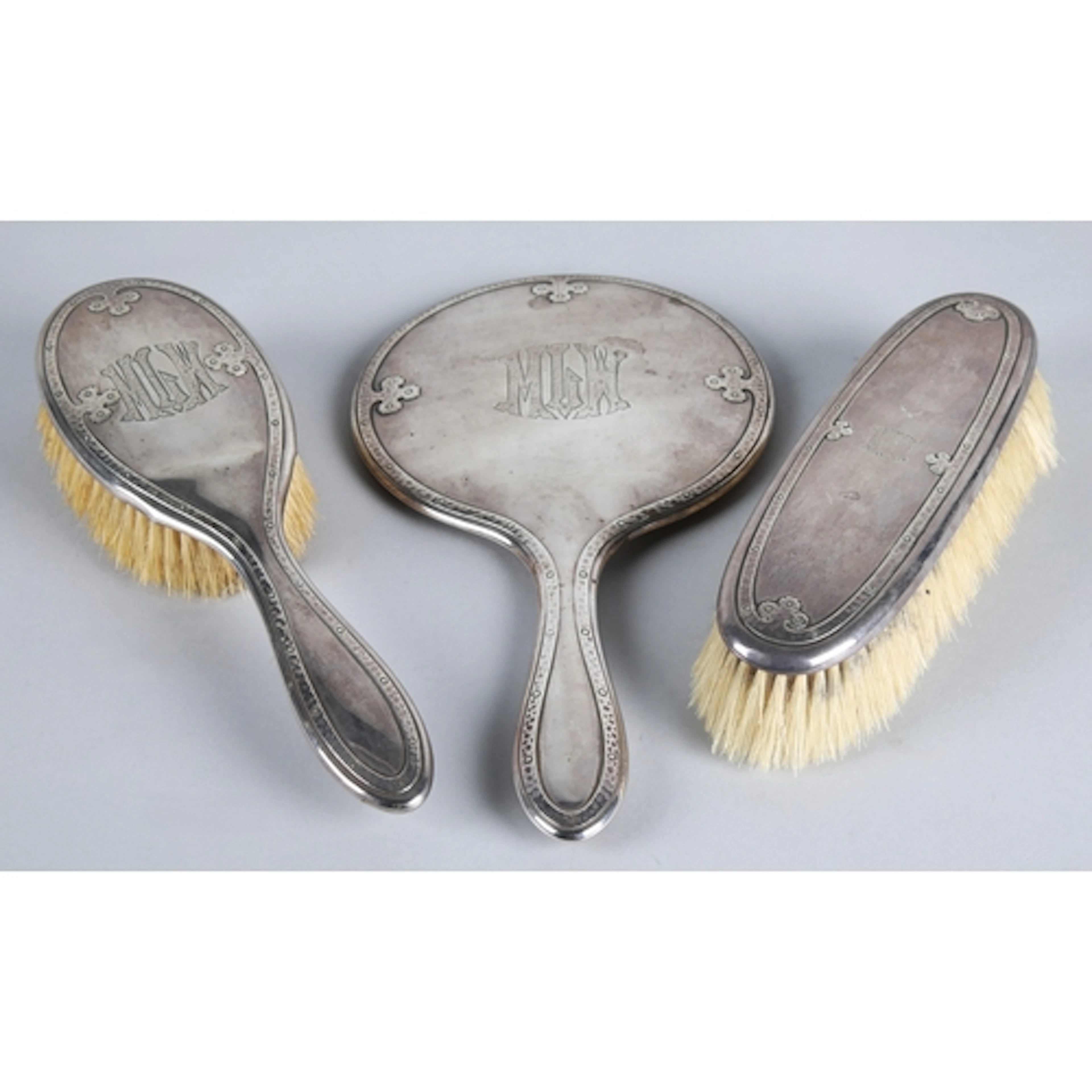 American silver backed three-piece vanity set, comprising of...