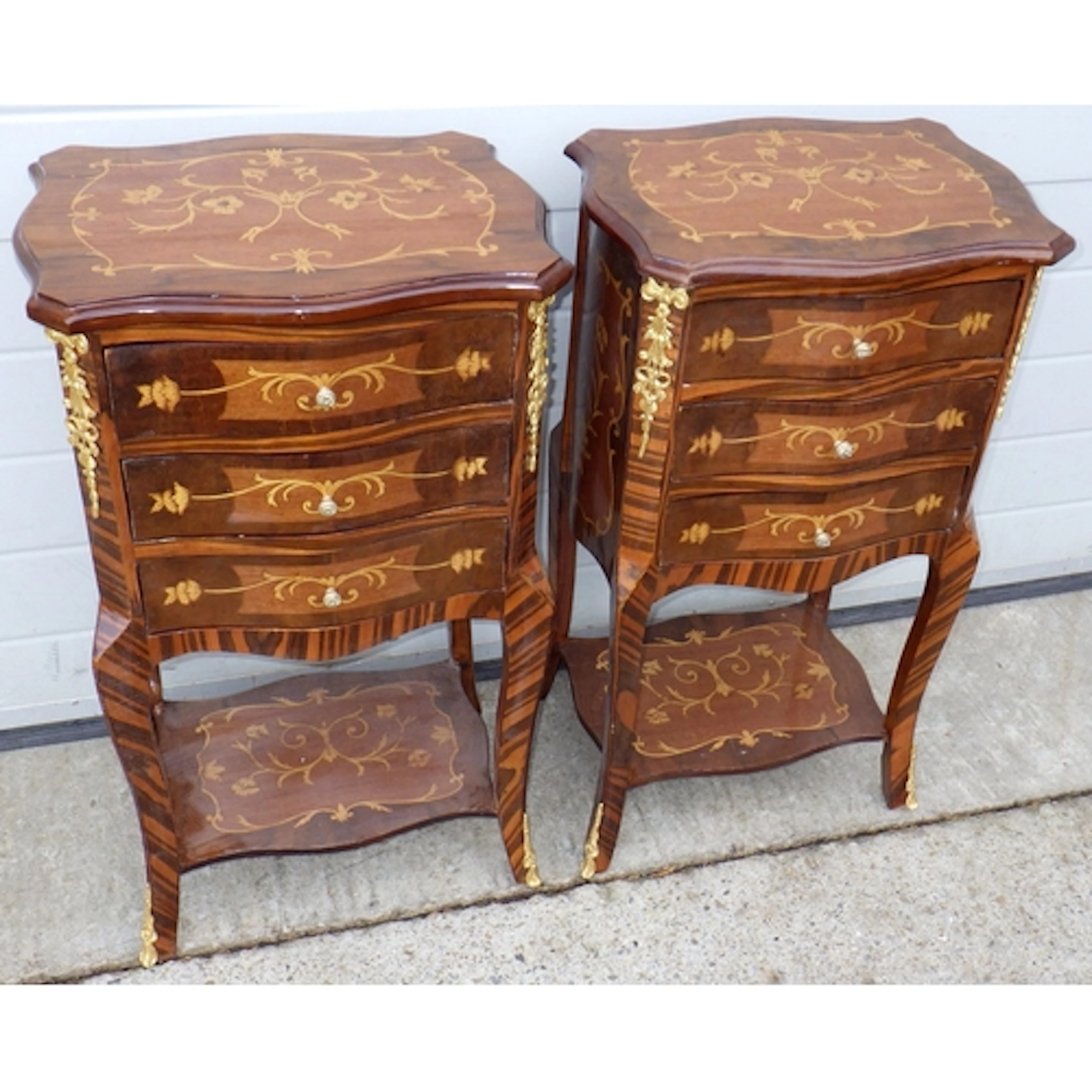 A pair of inlaid bedside tables