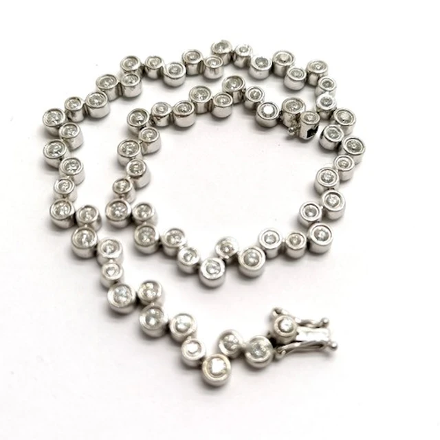18ct hallmarked white gold diamond set bracelet - 18cm & 11....