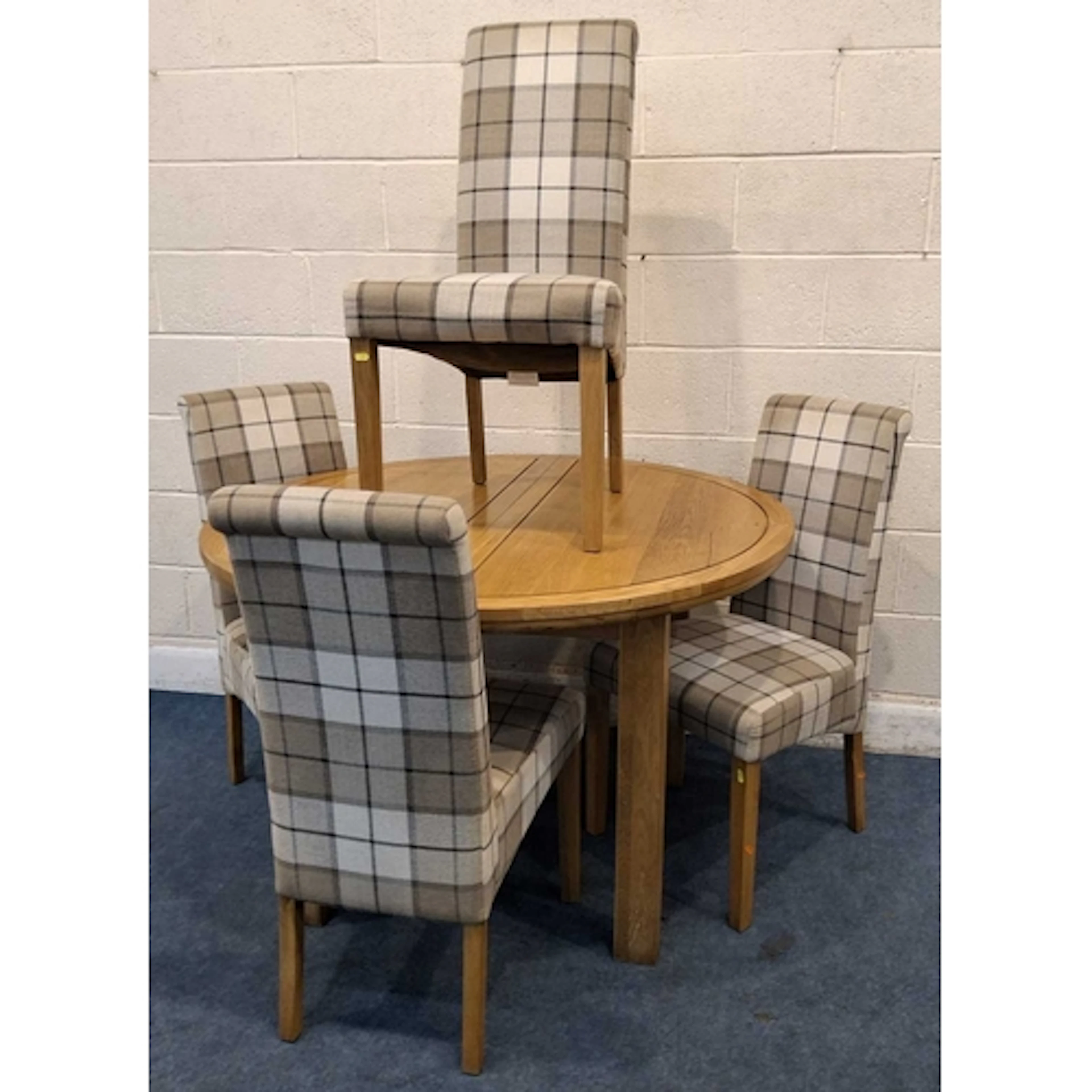 A MODERN LIGHT OAK EXTENDING DINING TABLE, with a single fol...