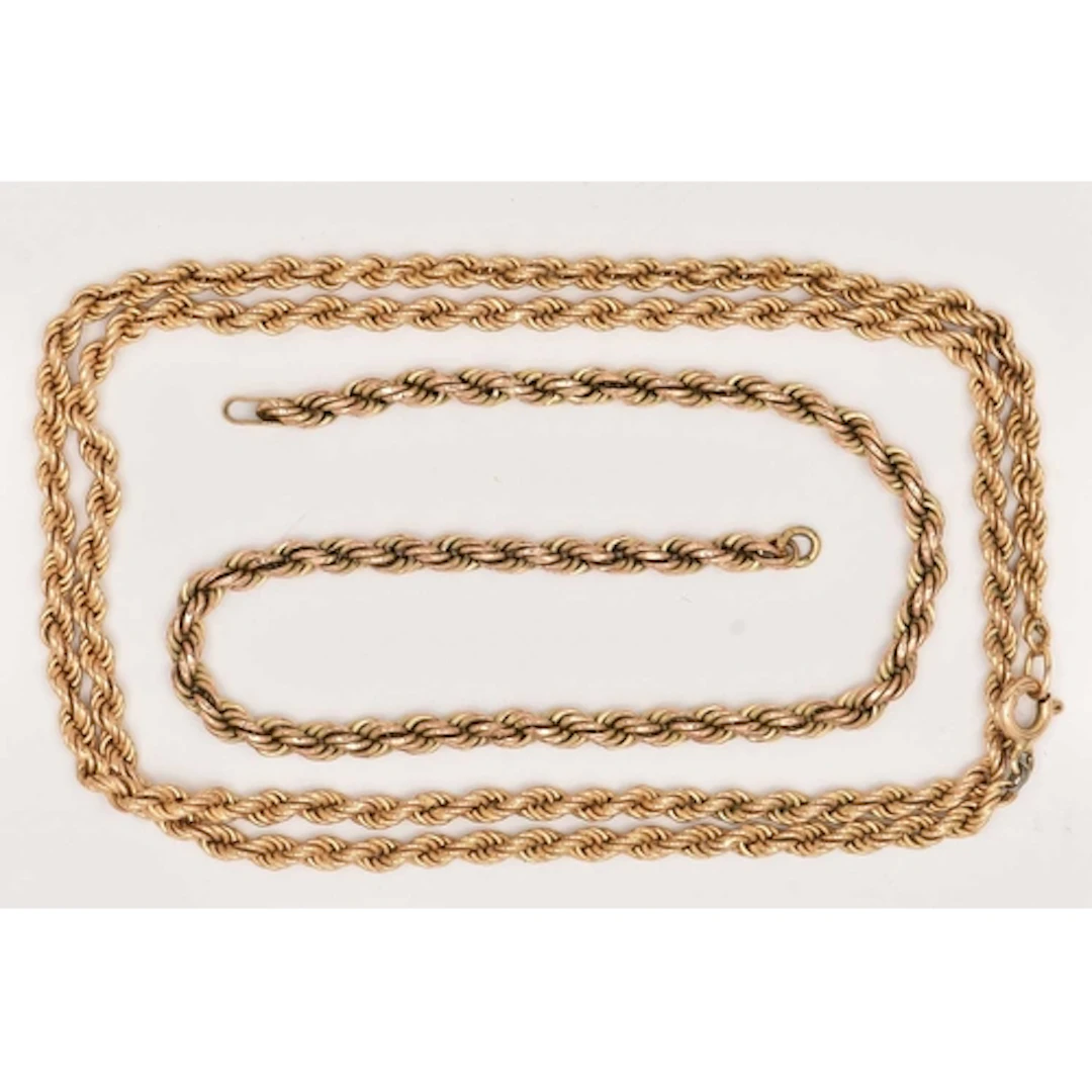 A YELLOW METAL ROPE TWIST CHAIN NECKLACE AND PART CHAIN, the...