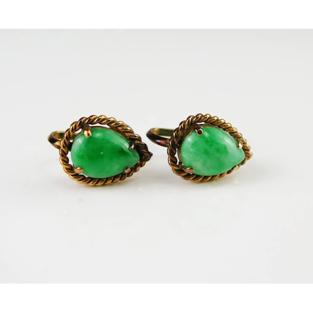 A pair of jade tear drop earrings in 14K yellow gold with sc...