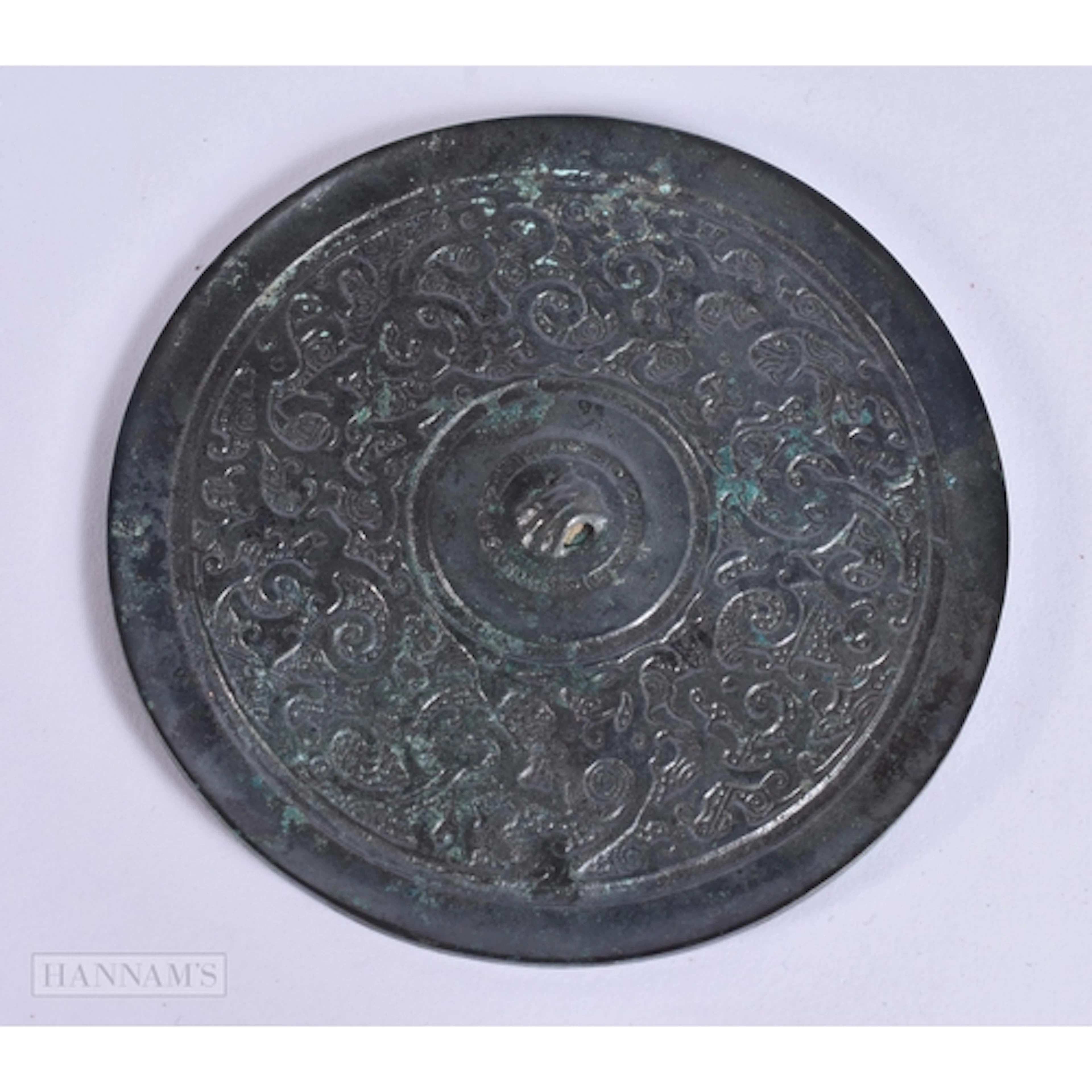 A CHINESE HAN DYNASTY SILVERED BRONZE HAND MIRROR 206 BC - 2...