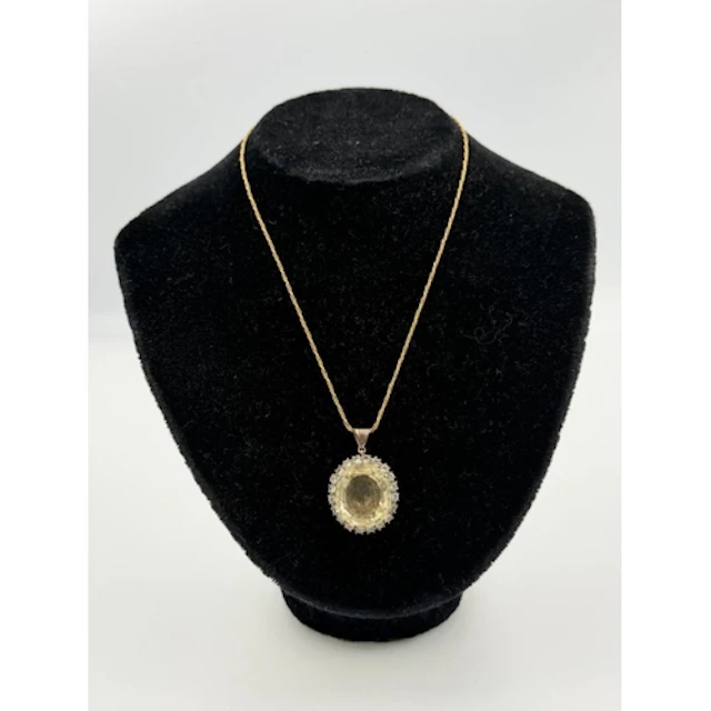 A citrine and diamond pendant on a 14ct gold necklace....