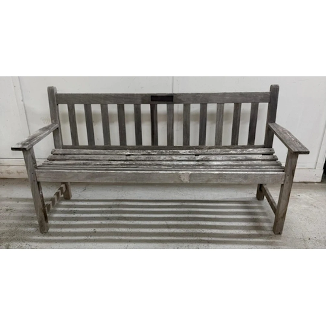 A wooden three seater garden bench.
