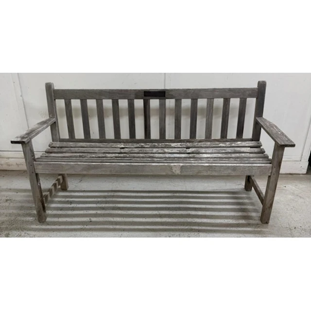 A wooden three seater garden bench.