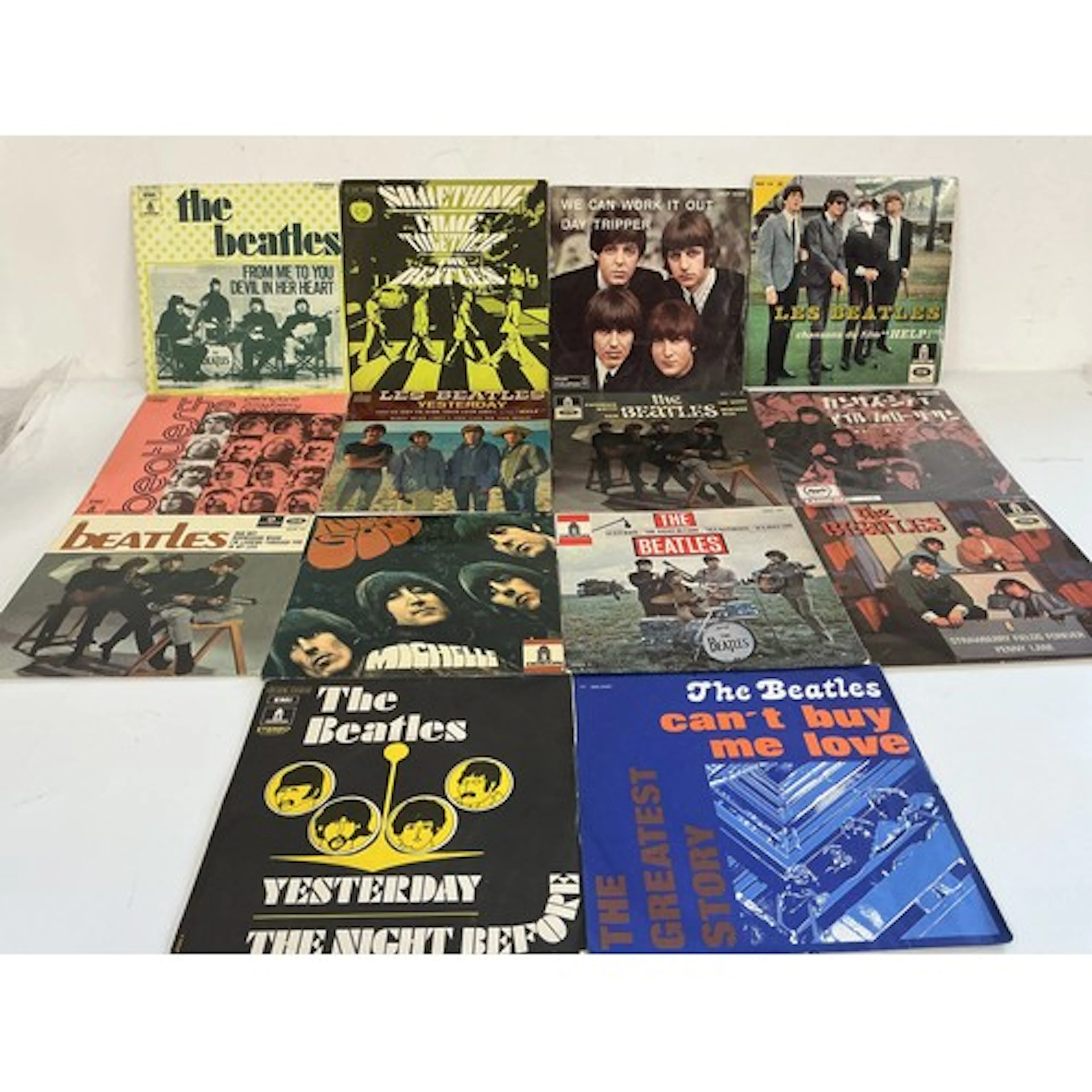 A collection of 14 foreign Beatles EPs comprising examples f...