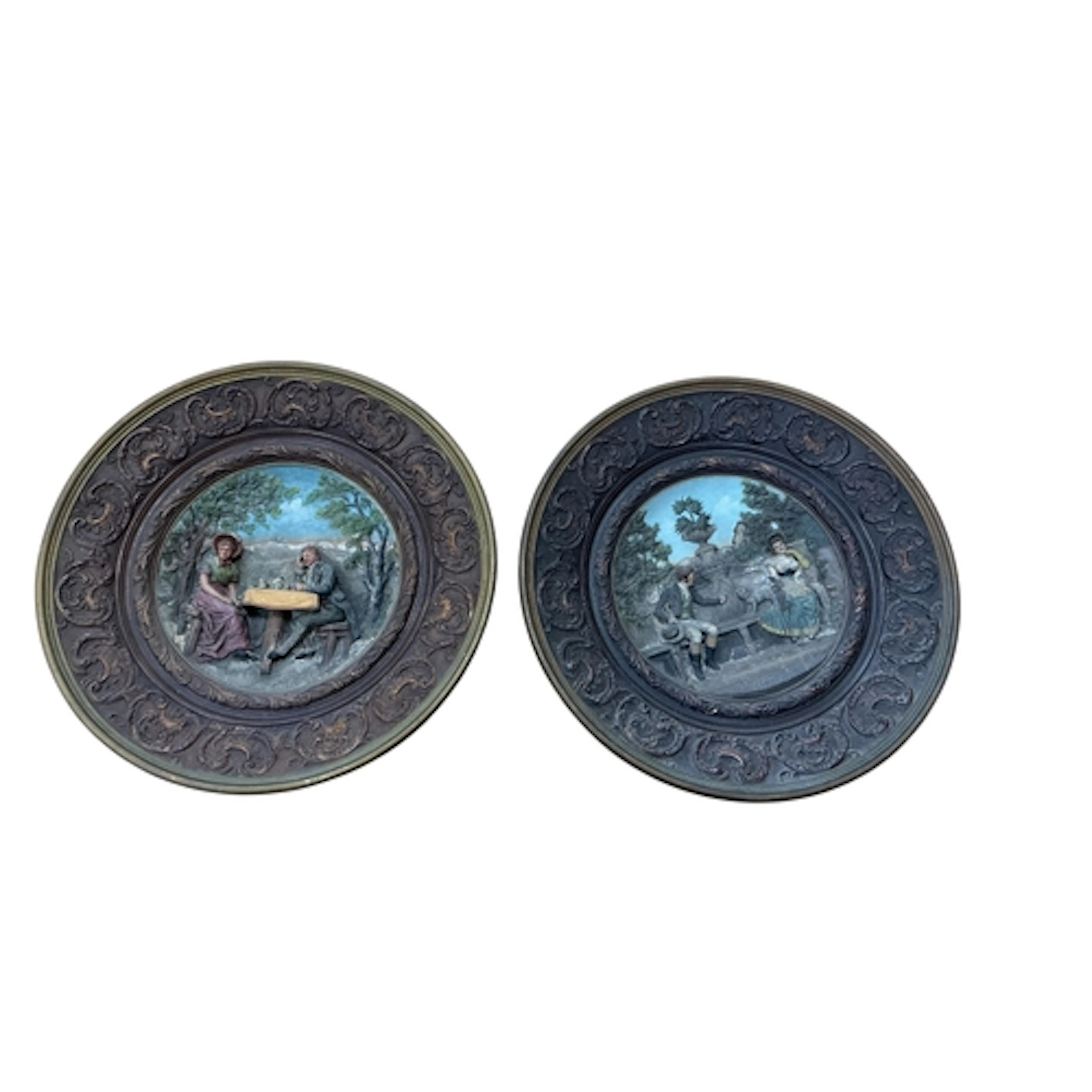 A pair of early 20th century Czech pottery relief moulded wa...