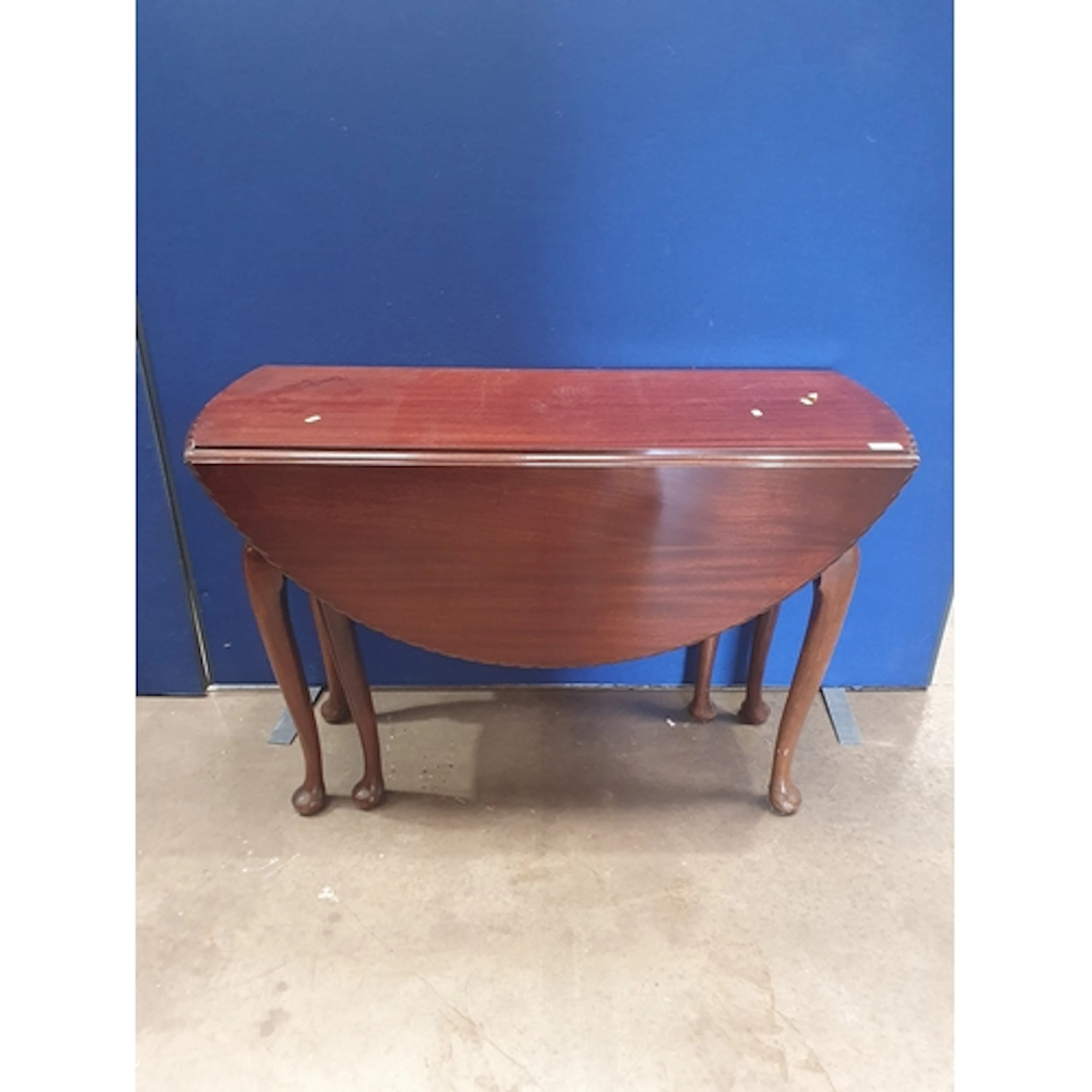 A Georgian style mahogany dropleaf Dining Table on pad feet ...