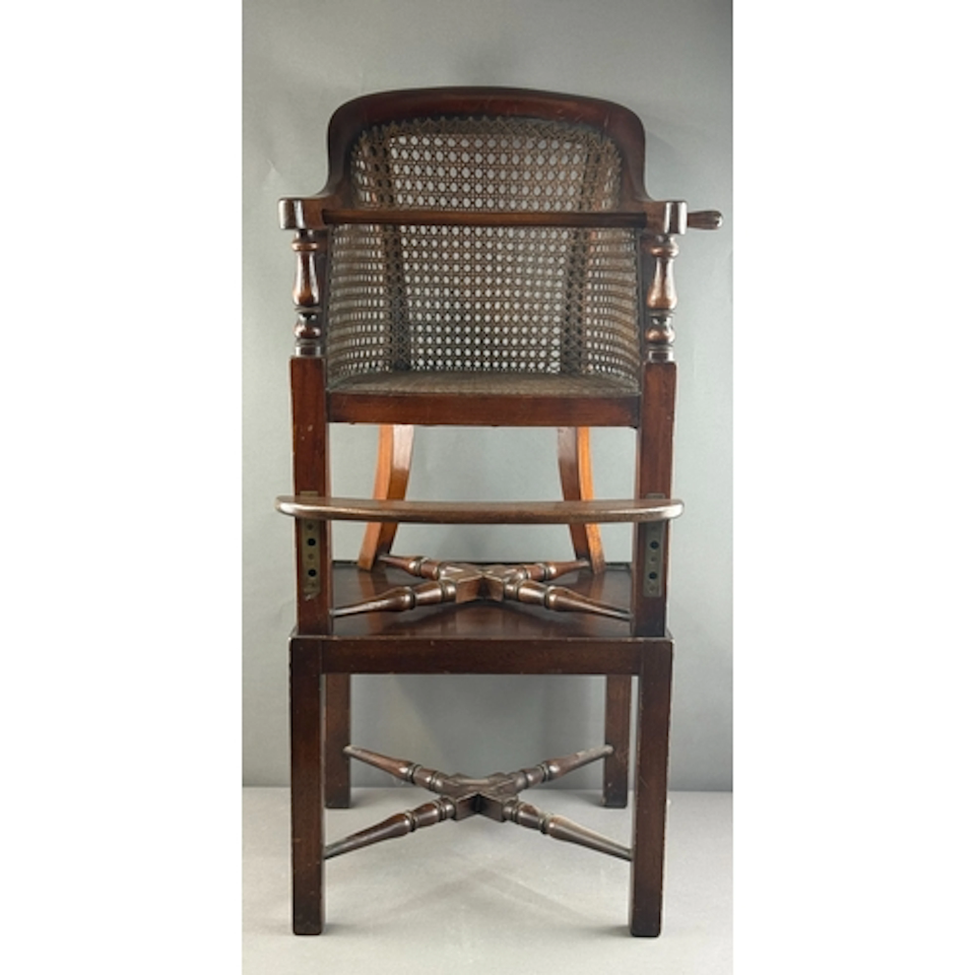 Furniture: an early to mid 19th century caned mahogany combi...
