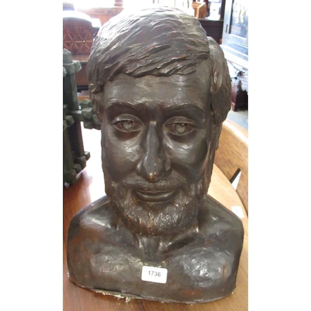 Brown patinated plaster bust of a bearded man