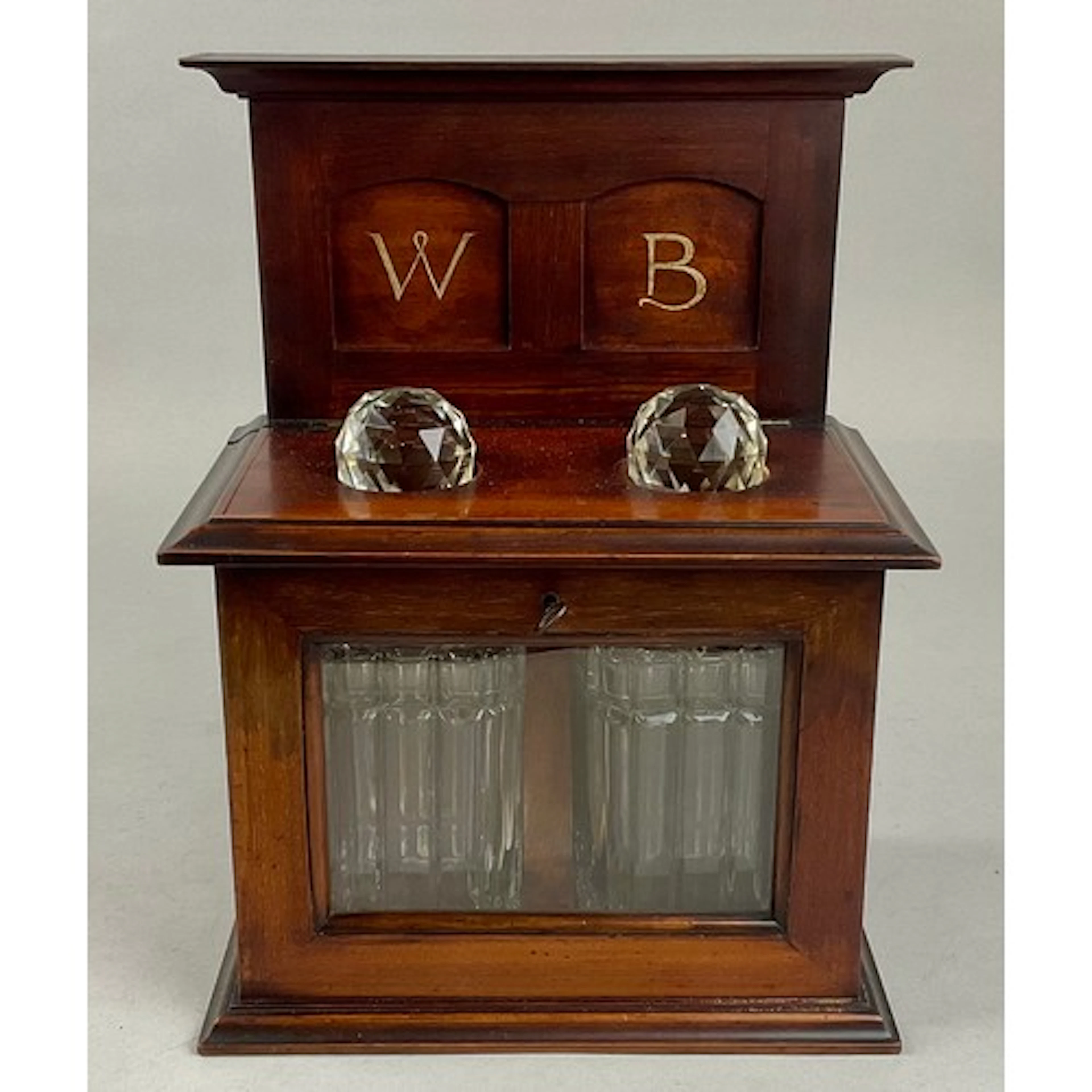 An unusual late Victorian/Edwardian mahogany tantalus decant...