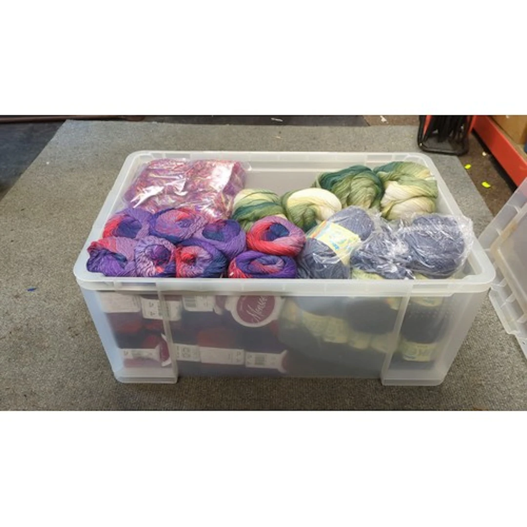 A quantity of knitting yarn in variegated purple, coral and ...