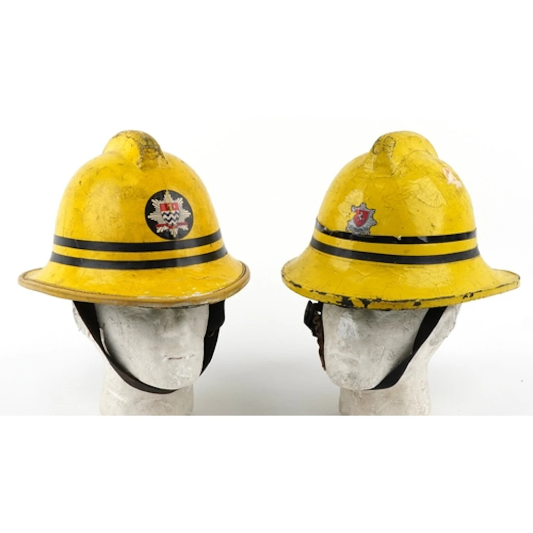 Two vintage Cork firemen's helmets with London Fire Brigade ...