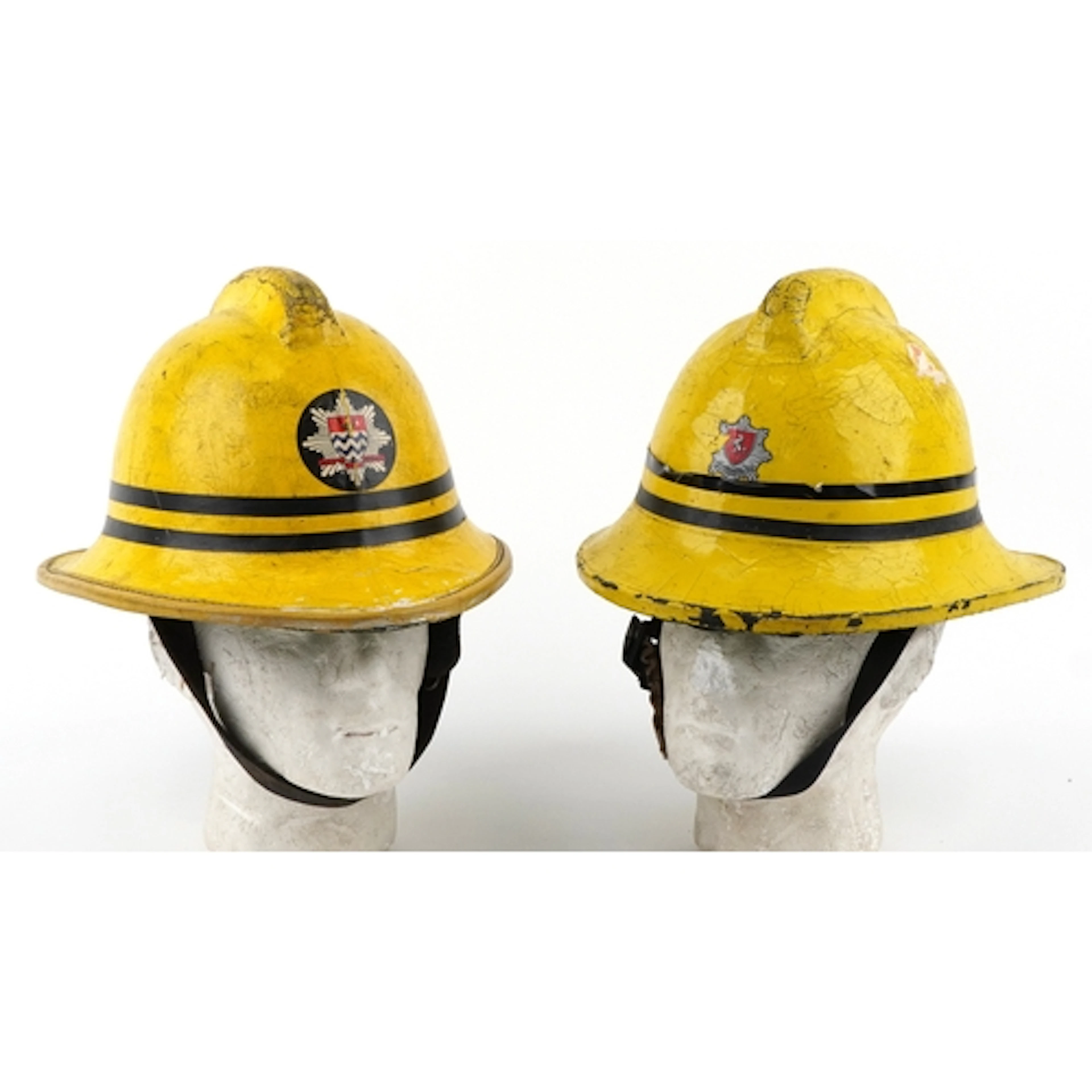 Two vintage Cork firemen's helmets with London Fire Brigade ...
