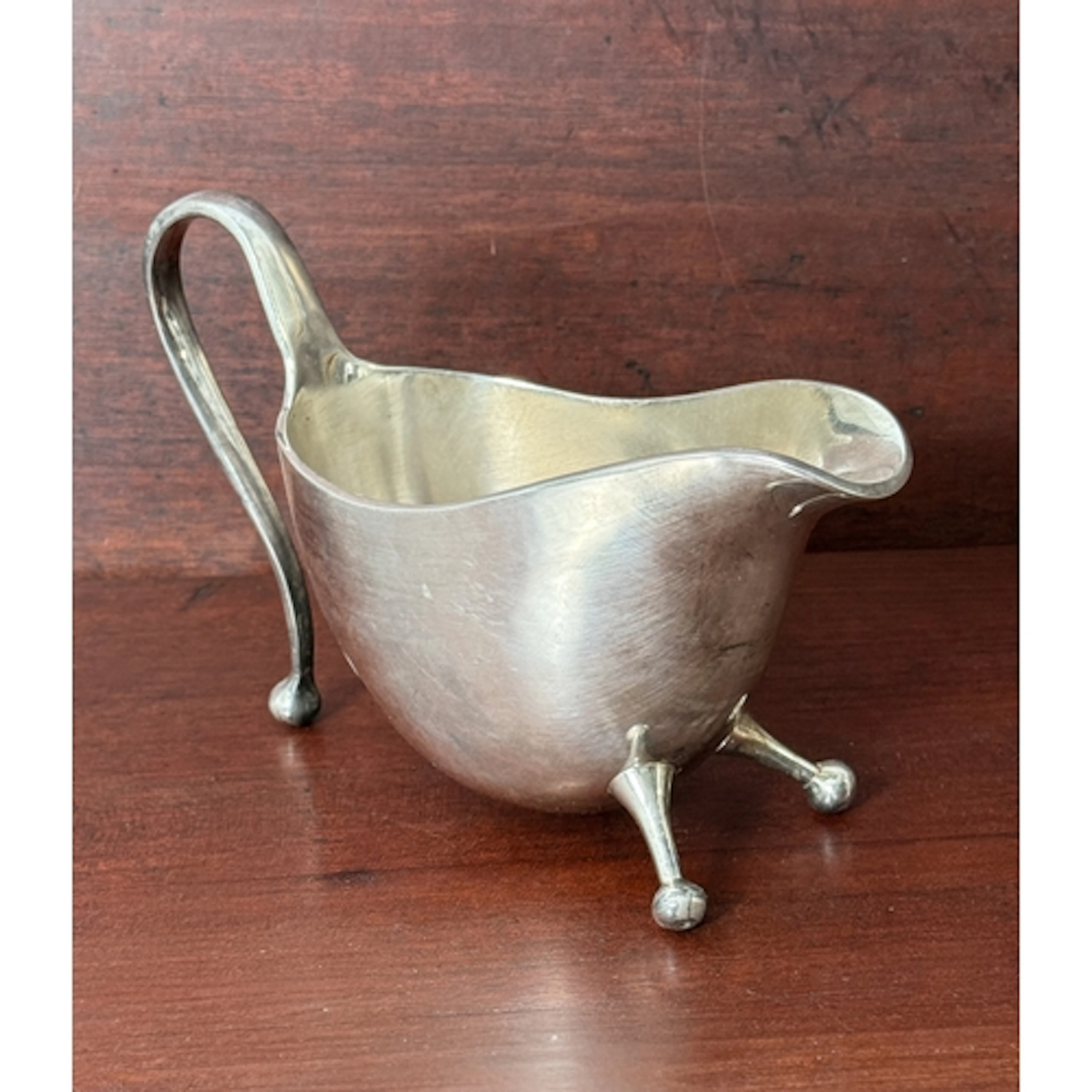 A modernist style silver plated sauce boat in the manner of ...