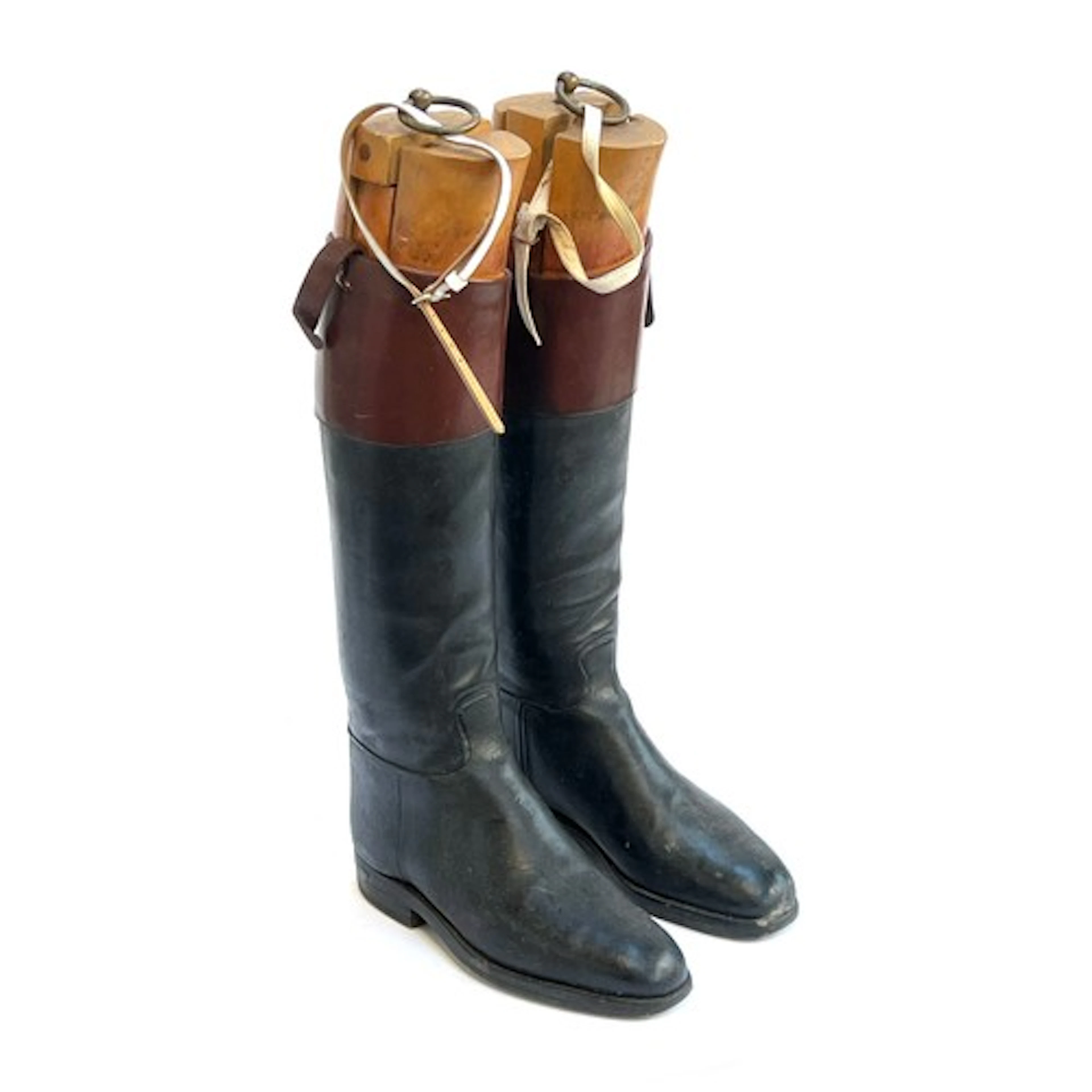 A pair of black leather hunting boots with mahogany tops and...