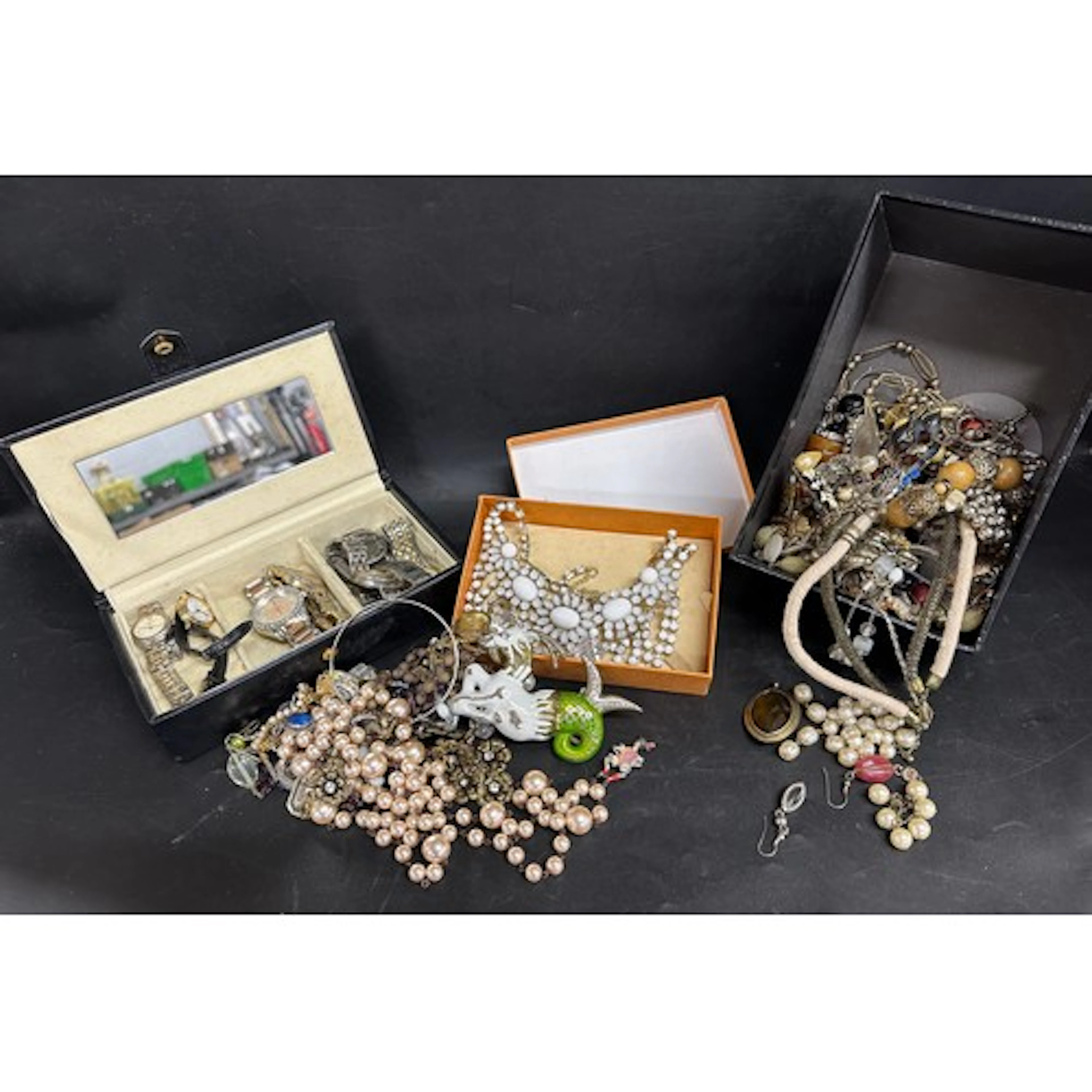 A collection of costume jewellery and wristwatches