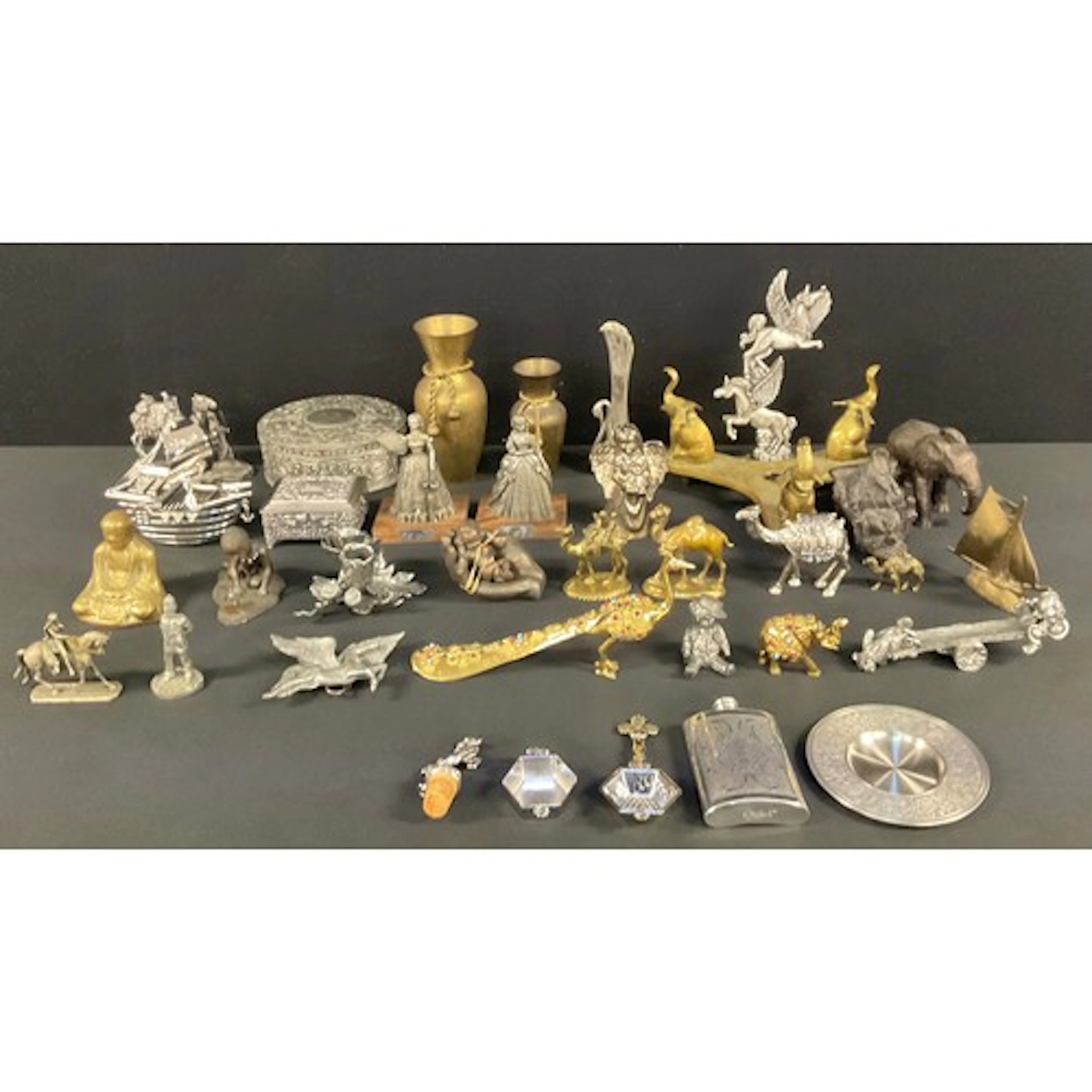 A Sri Lankan brass tripod stand with three elephant supports...