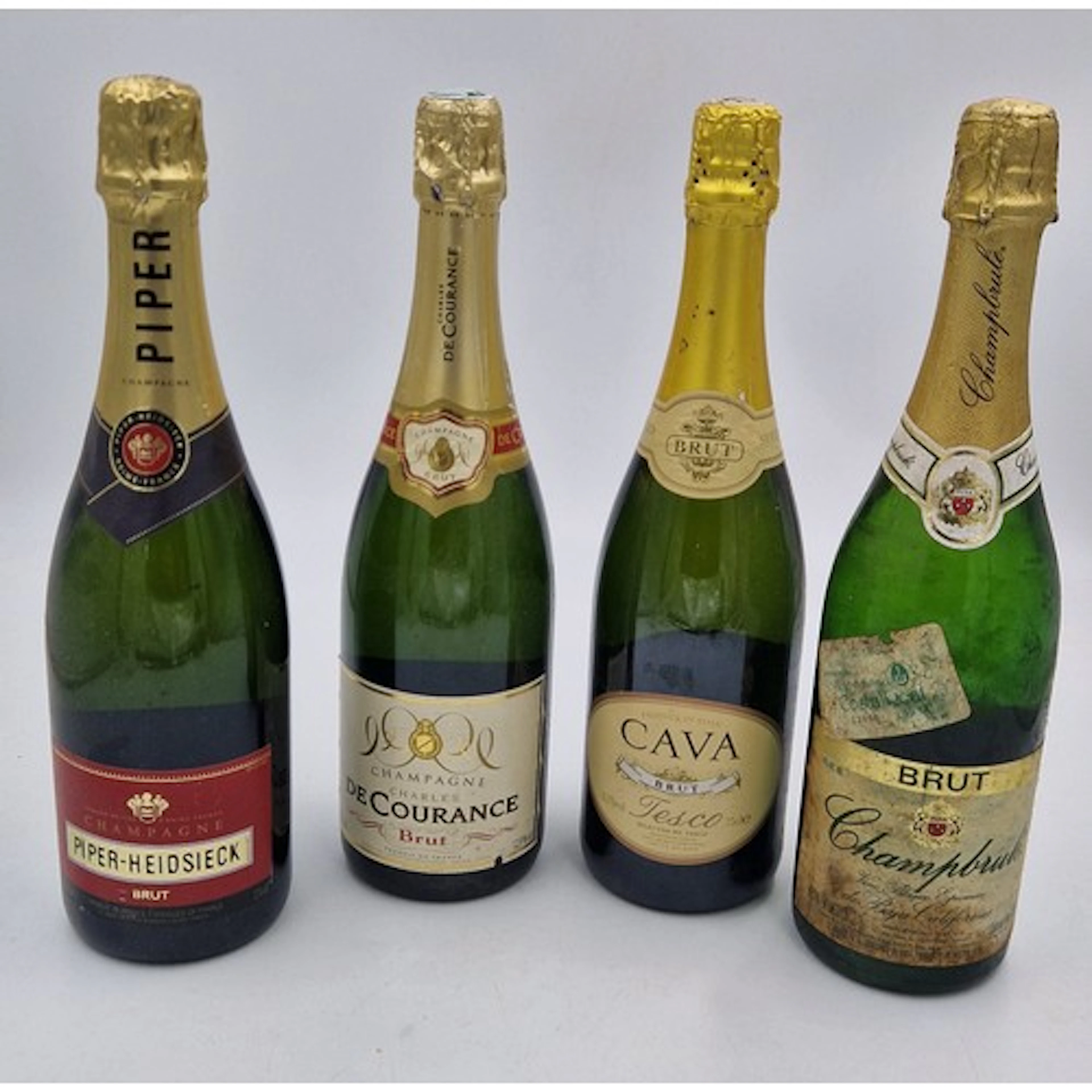 Three bottles of champagne to include: Charles de Courance B...