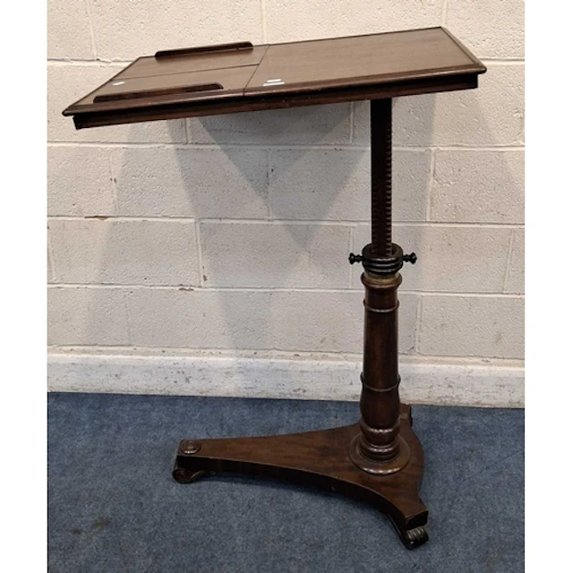 A REGENCY MAHOGANY READING TABLE, with two tilting surfaces,...