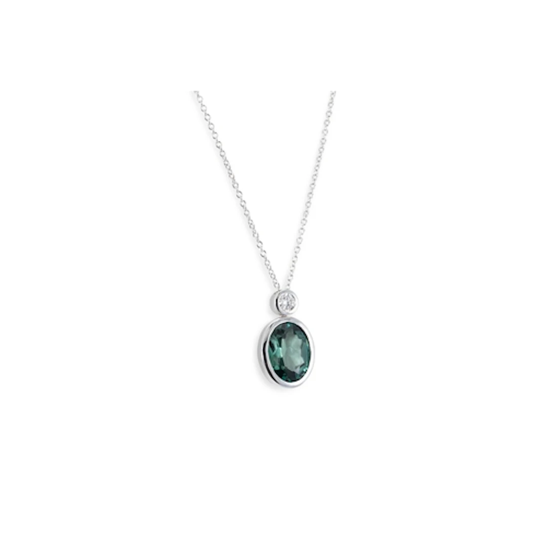 A GREEN TOURMALINE AND DIAMOND SET PENDANT, the bezel round ...