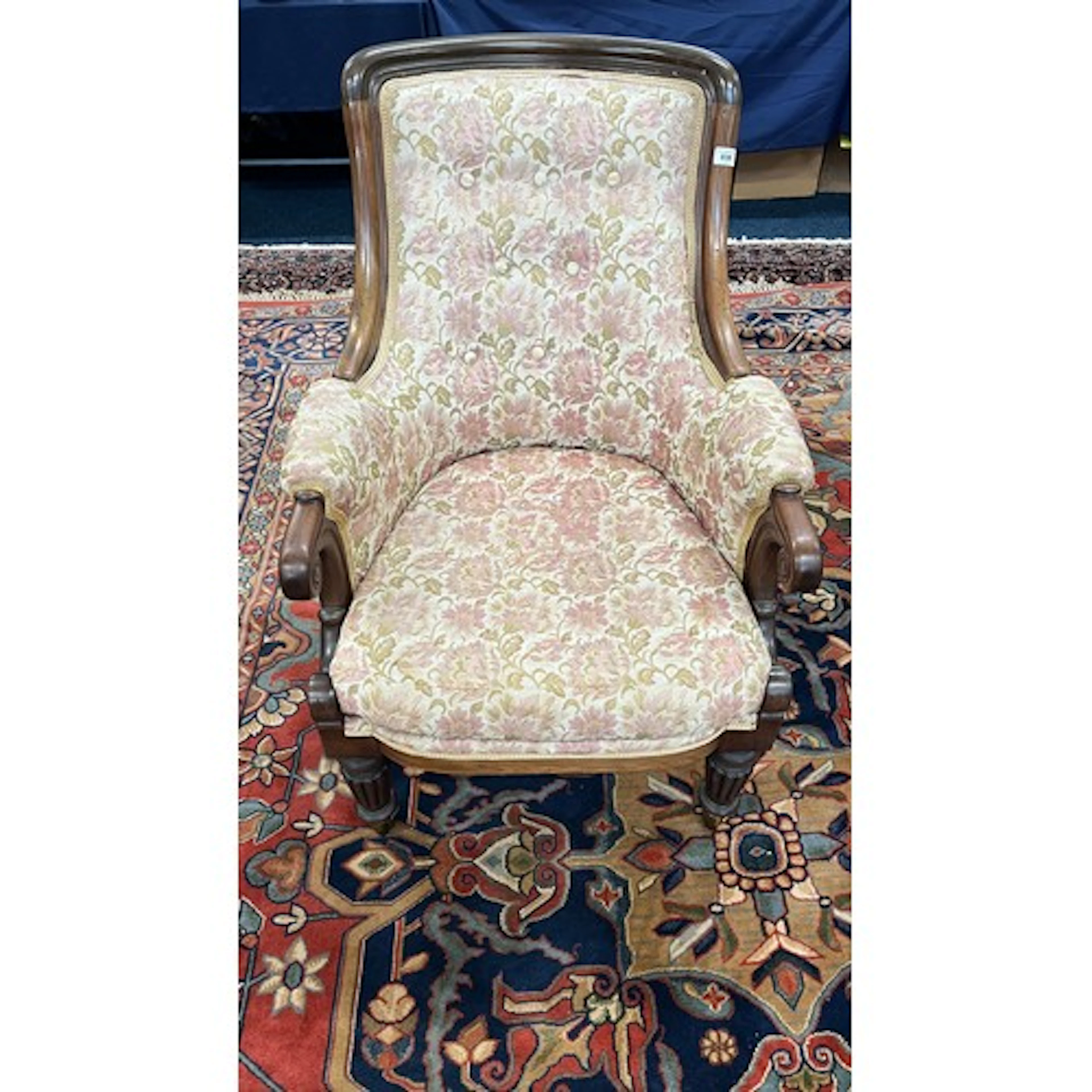 Victorian upholstered armchair raised on turned fluted supp...