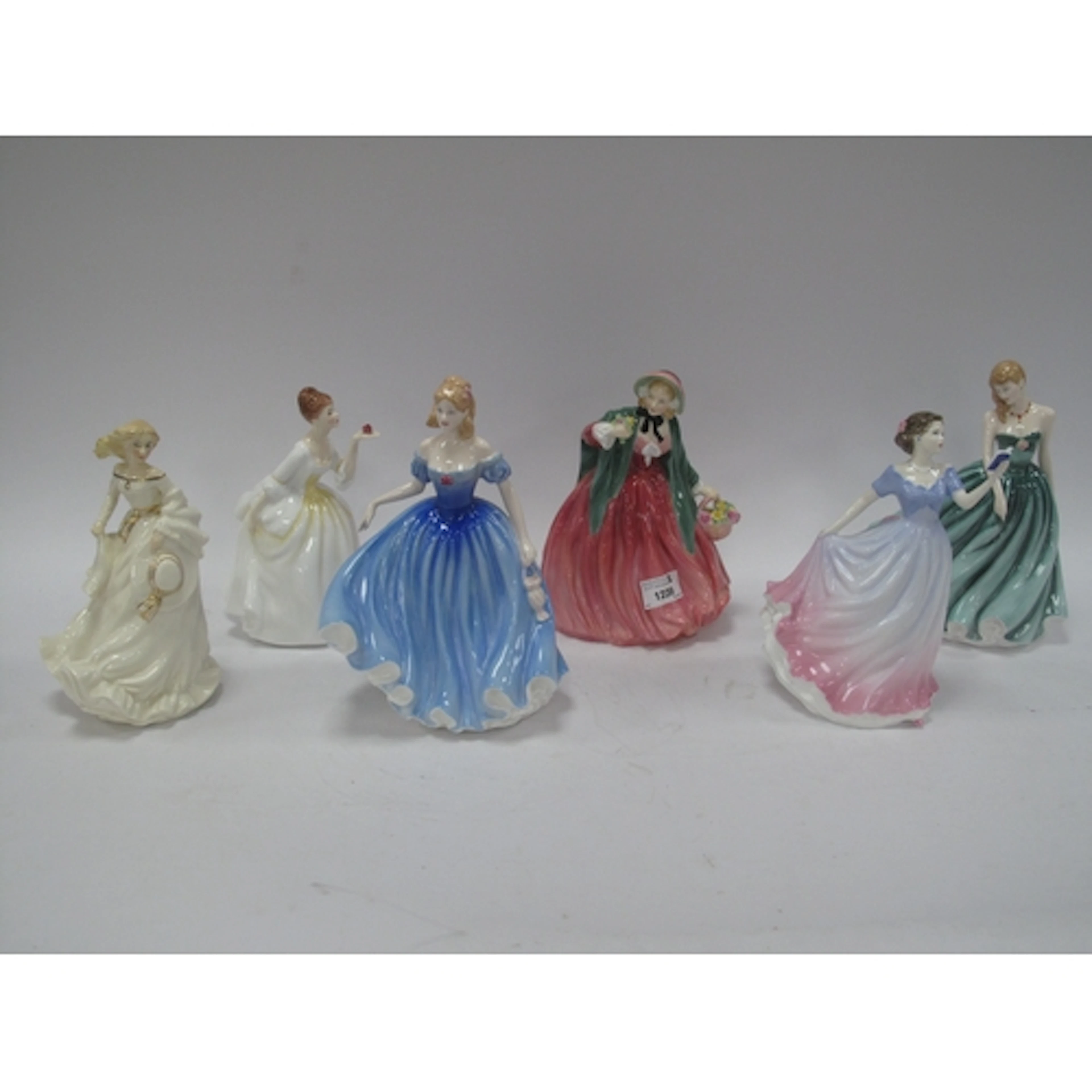 Six Royal Doulton bone china ladies' figures, featuring "Lad...