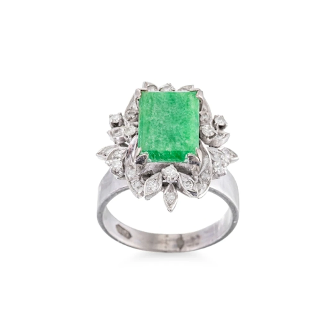 A DIAMOND AND JADE CLUSTER RING, the rectangular jade and di...