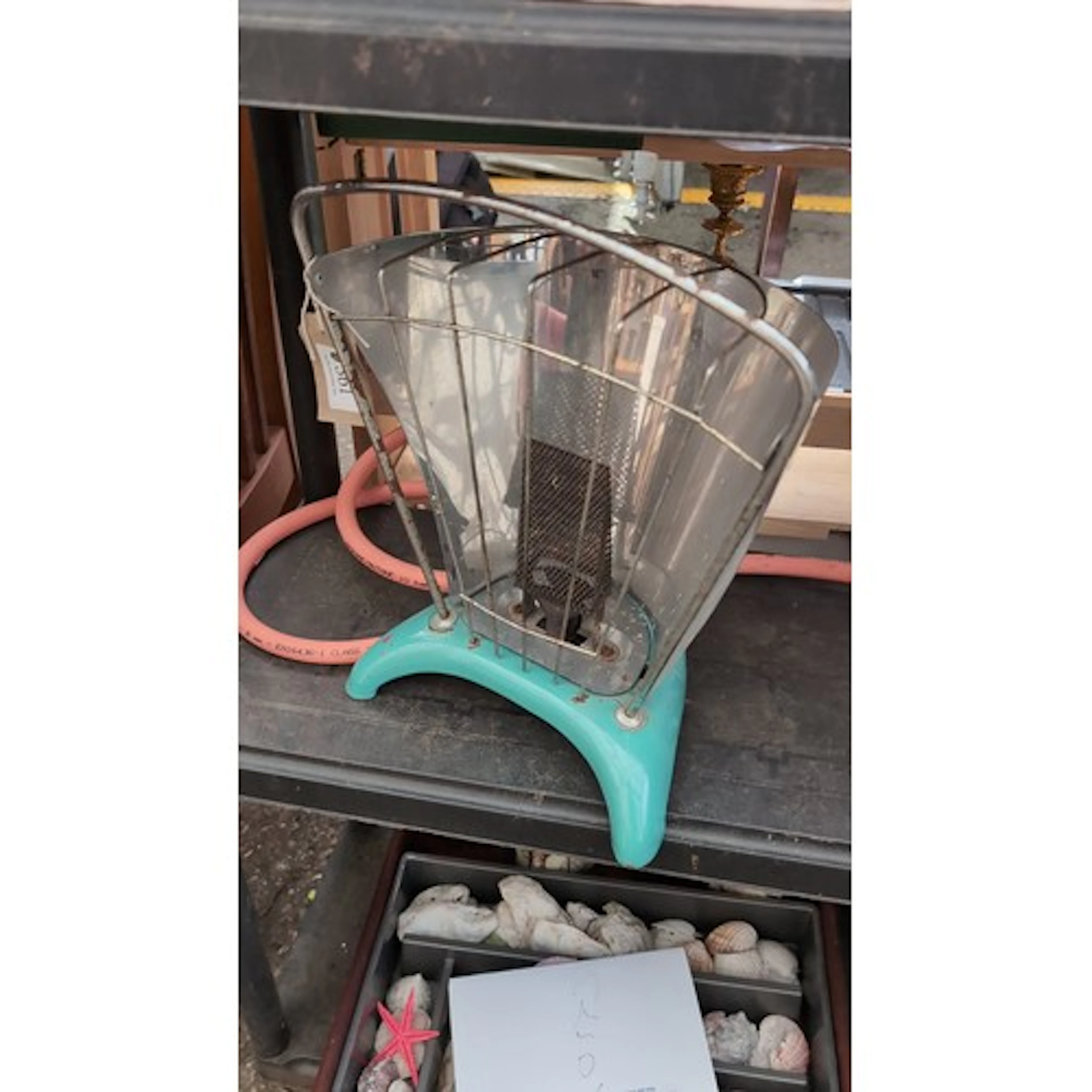 Portable table heater with turquoise enamelled base, wire gu...