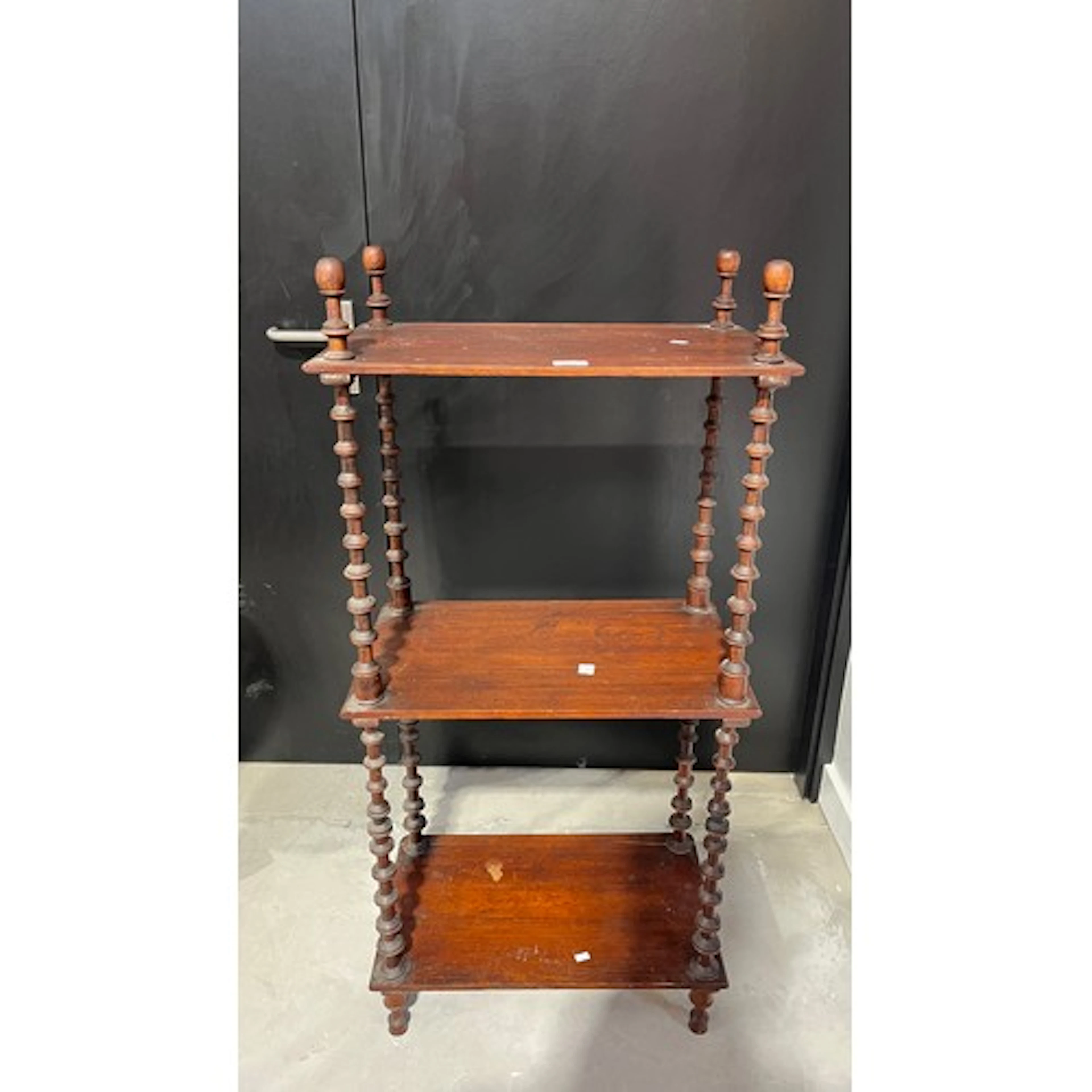 Three tier what-not of rectangular form, turned finials on ...