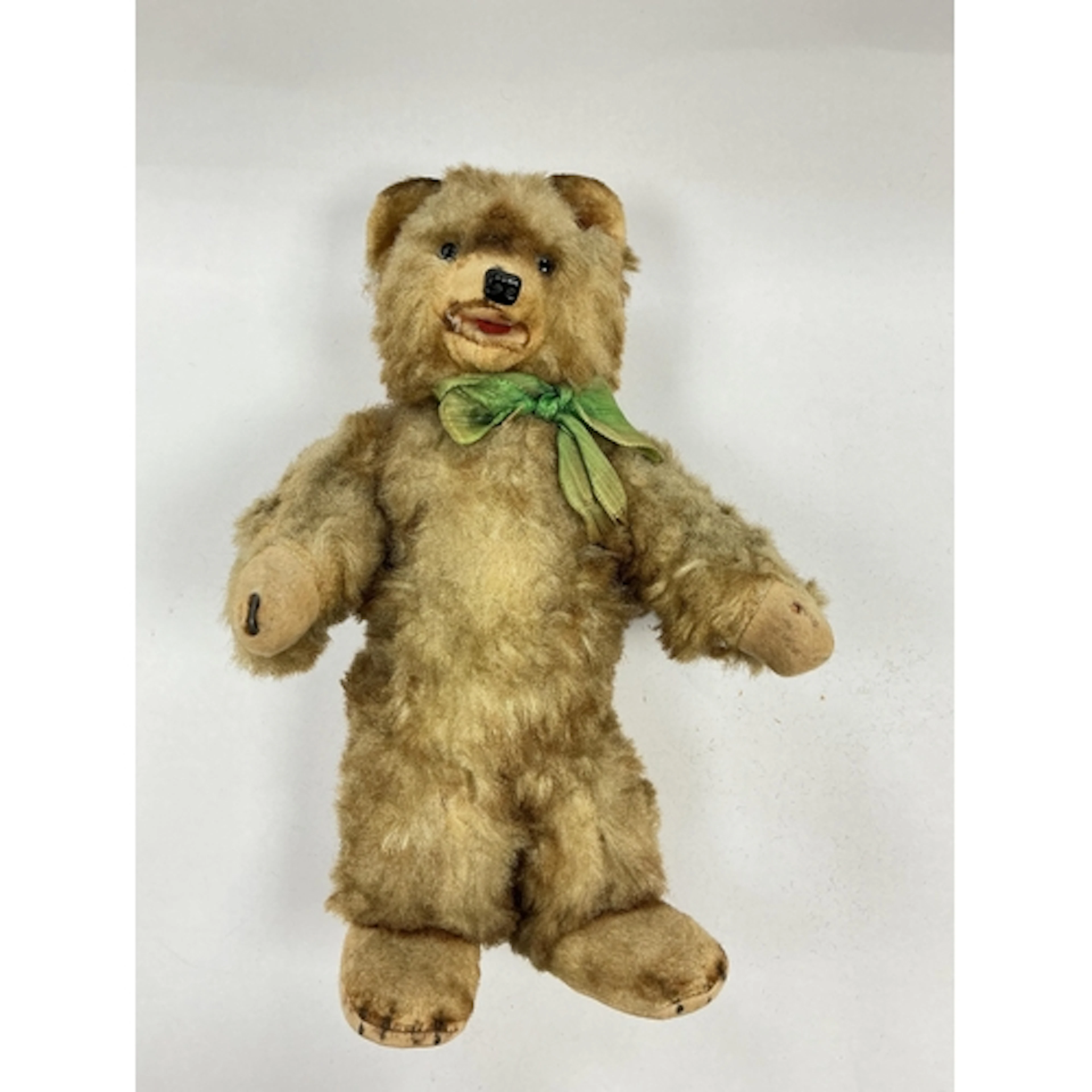 A mid 20th century teddy bear, possibly by Steiff, approxima...