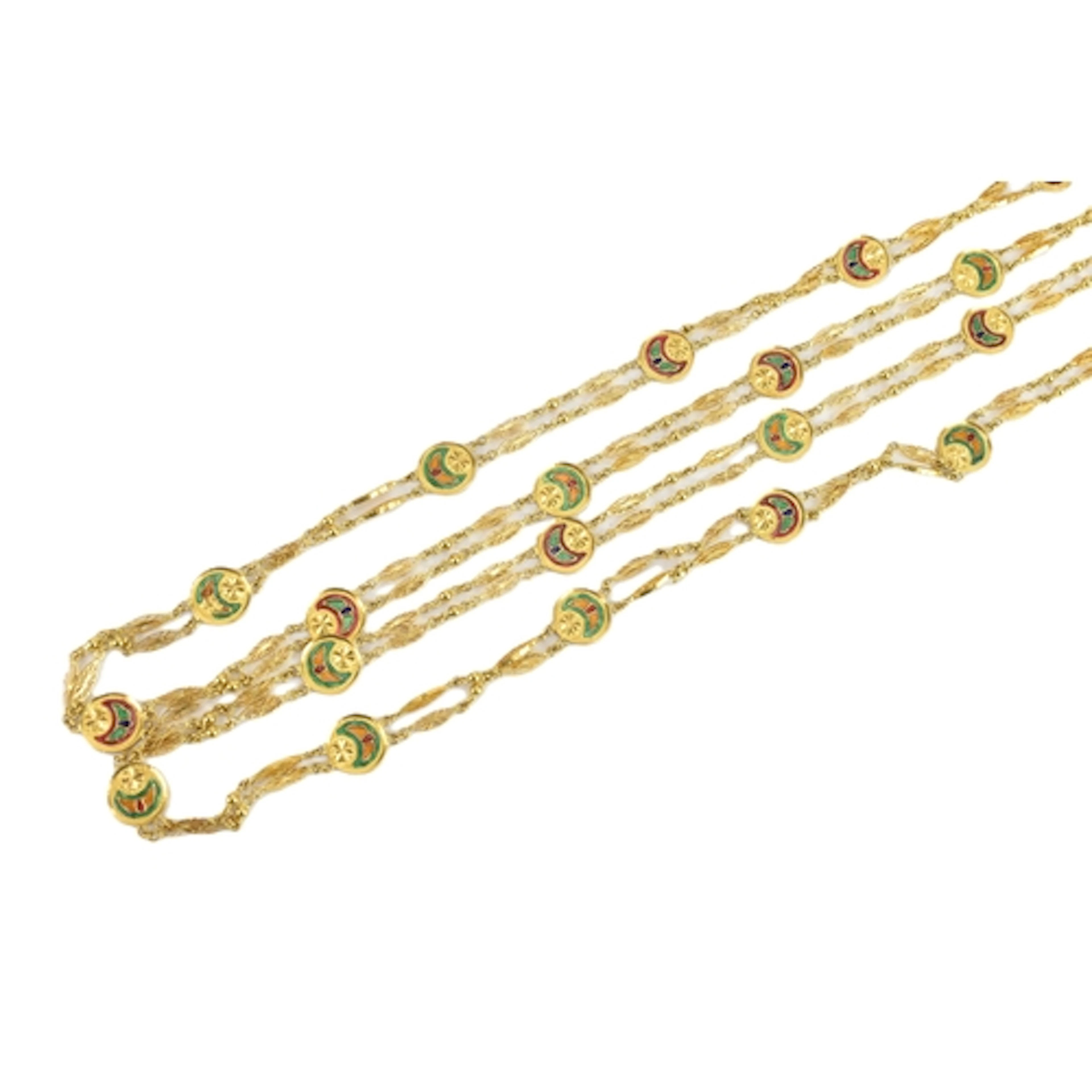 A yellow gold and enamel long chain necklace, testing as 20-...