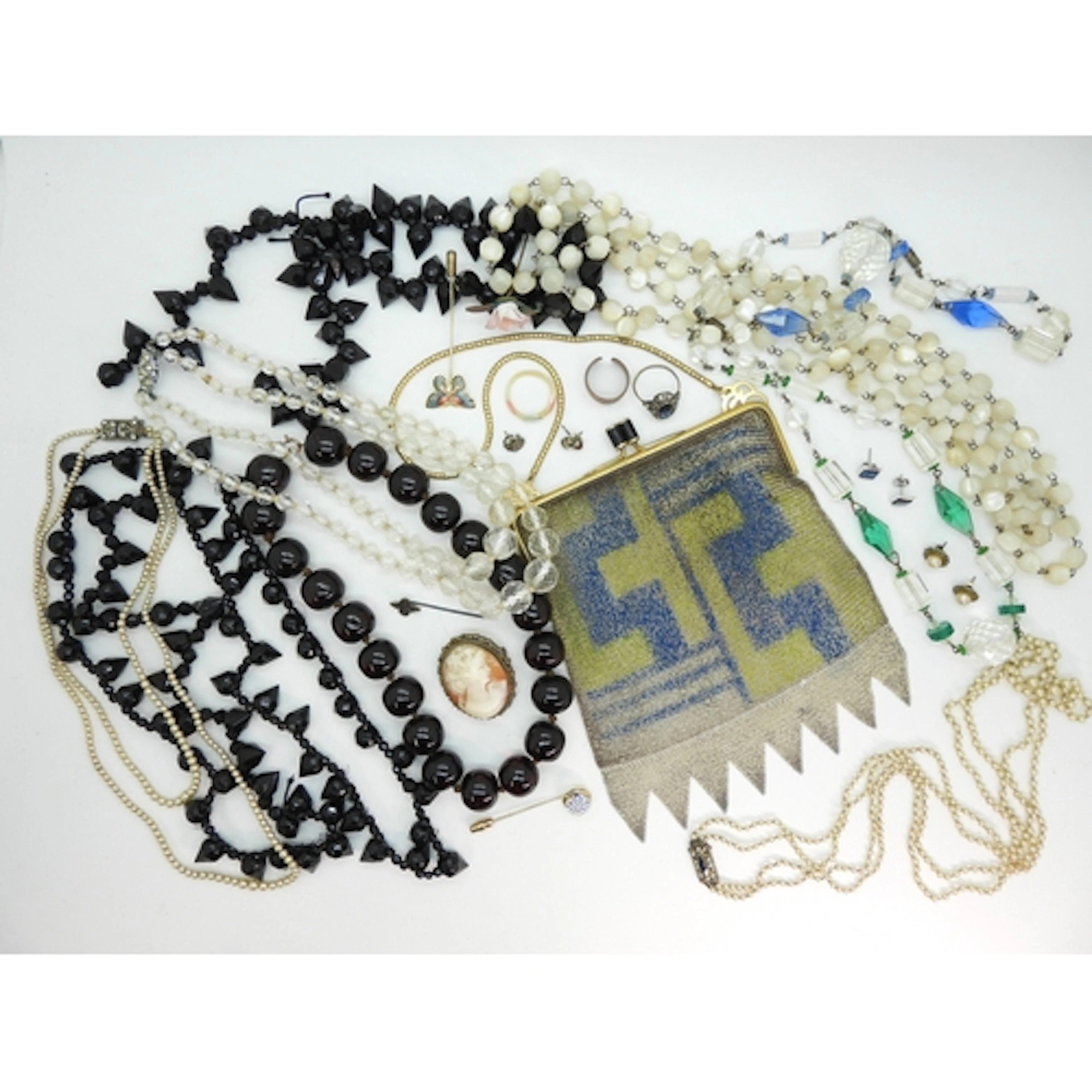 An Art Deco mesh purse, a Caithness Glass topped lapel pin, ...