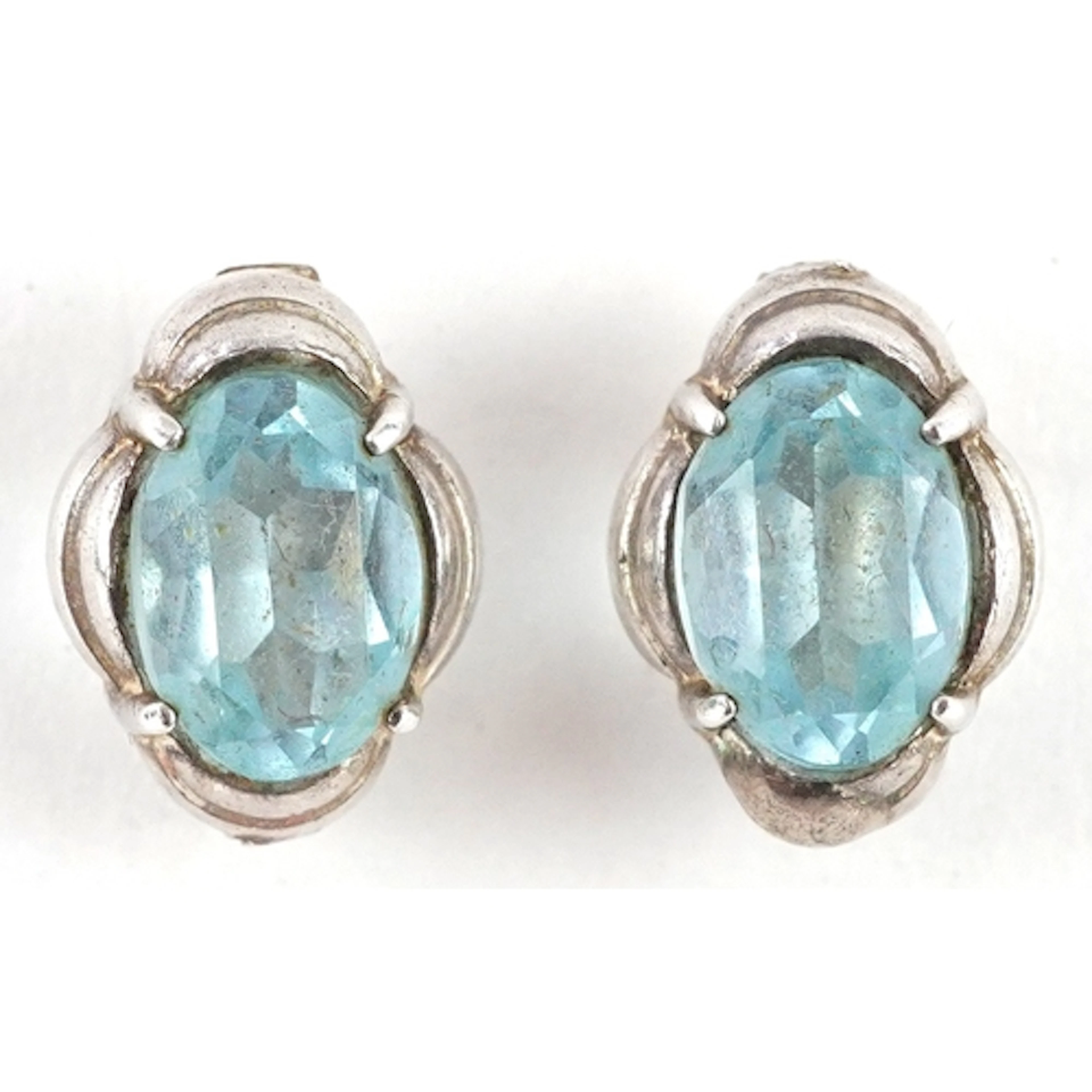 Pair of unmarked white gold blue stone stud earrings, marked...
